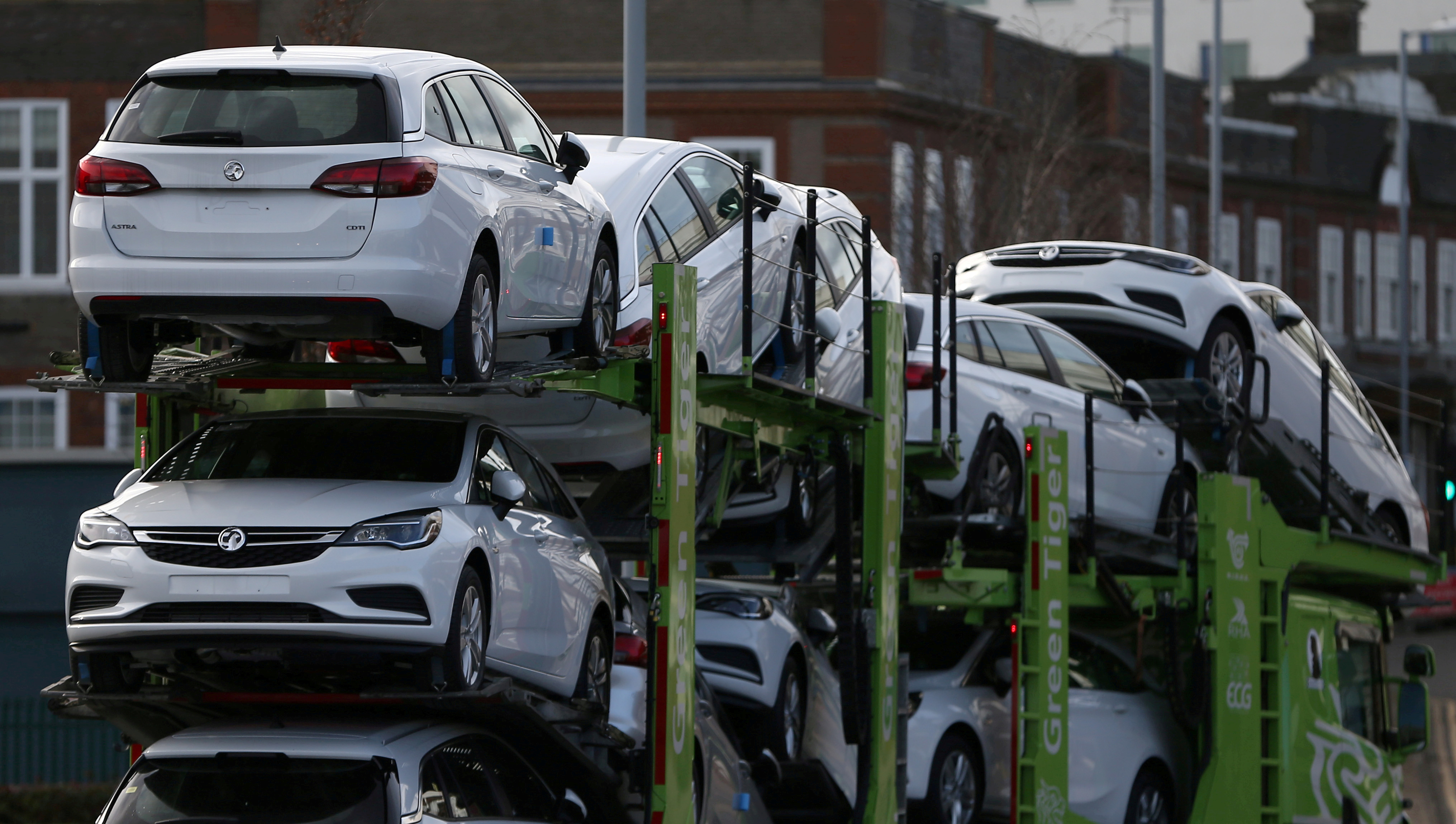 Vauxhall cars are transported on a lorry in Luton, Britain