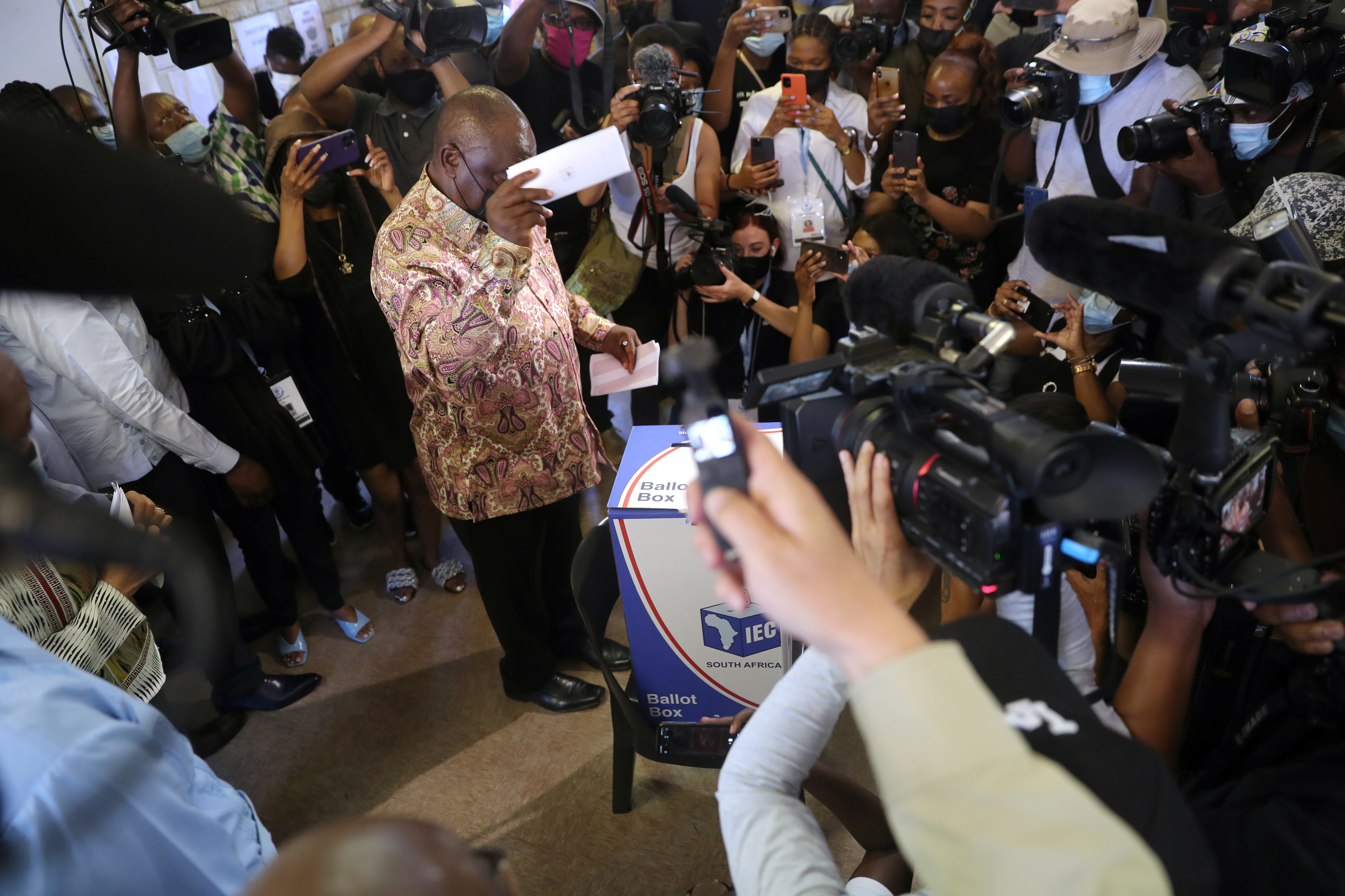 South African President Cyril Ramaphosa casts his ballot at a polling station during local government elections in Soweto, Johannesburg, South Africa, November 1, 2021. REUTERS/Sumaya Hisham