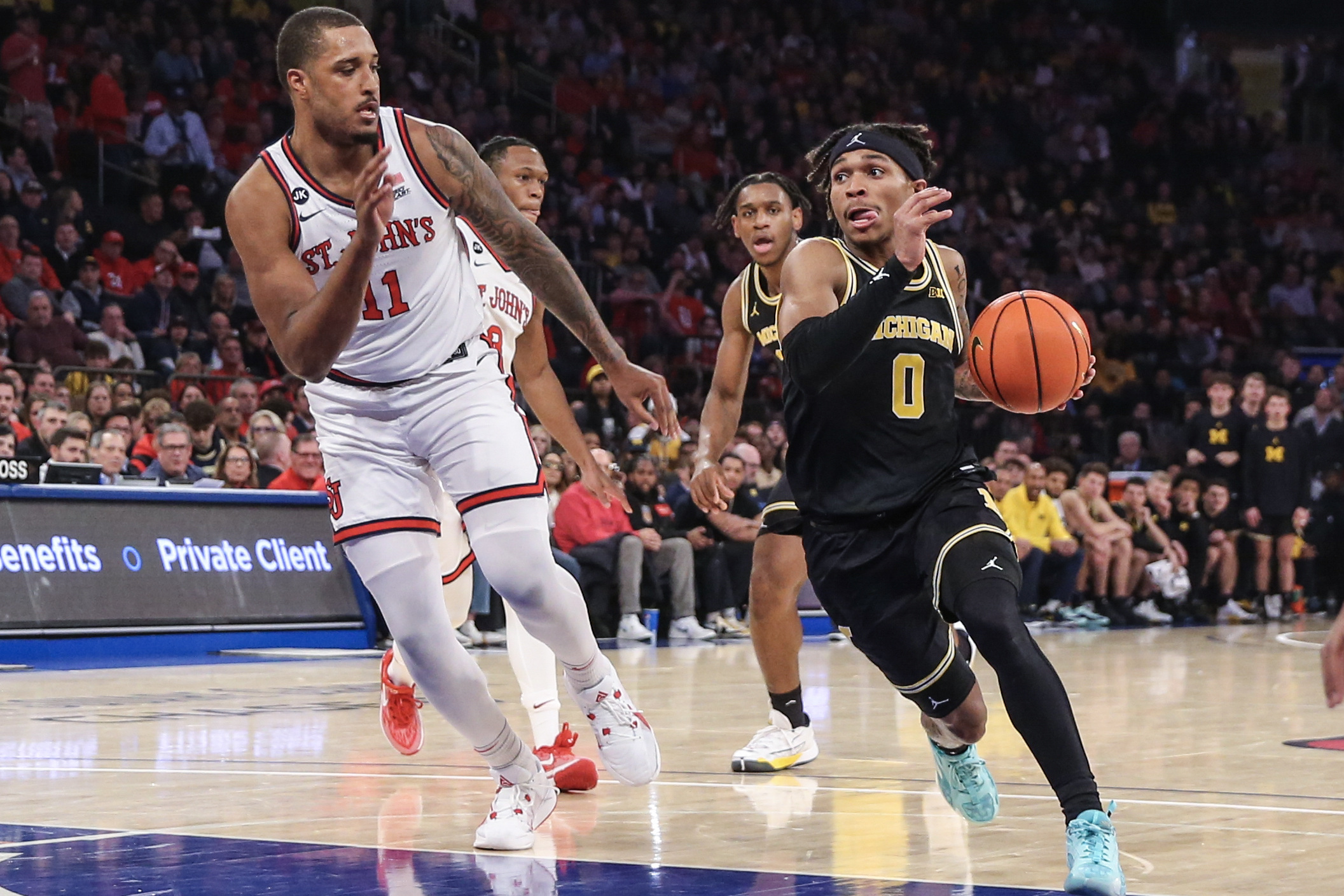 Dug McDaniel, Nimari Burnett Power Michigan Past St. John's | Reuters