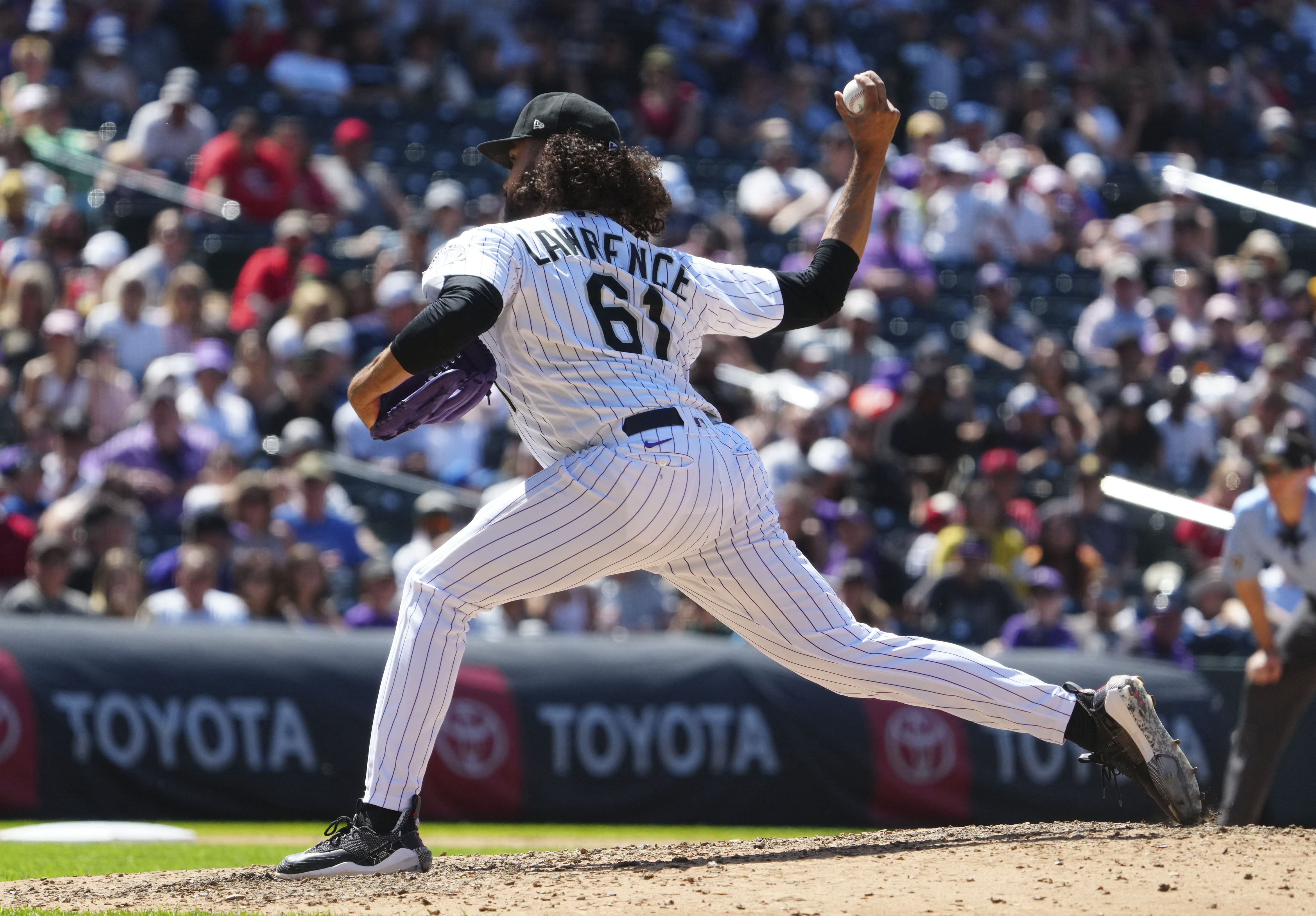 Colorado Rockies designated hitter, Jorge Alfaro (38) waits for the pitch  in an MLB baseball game against the Los Angeles Angels.The Angels defeated  the Rockies 4-3 in Denver on Sunday, June 25