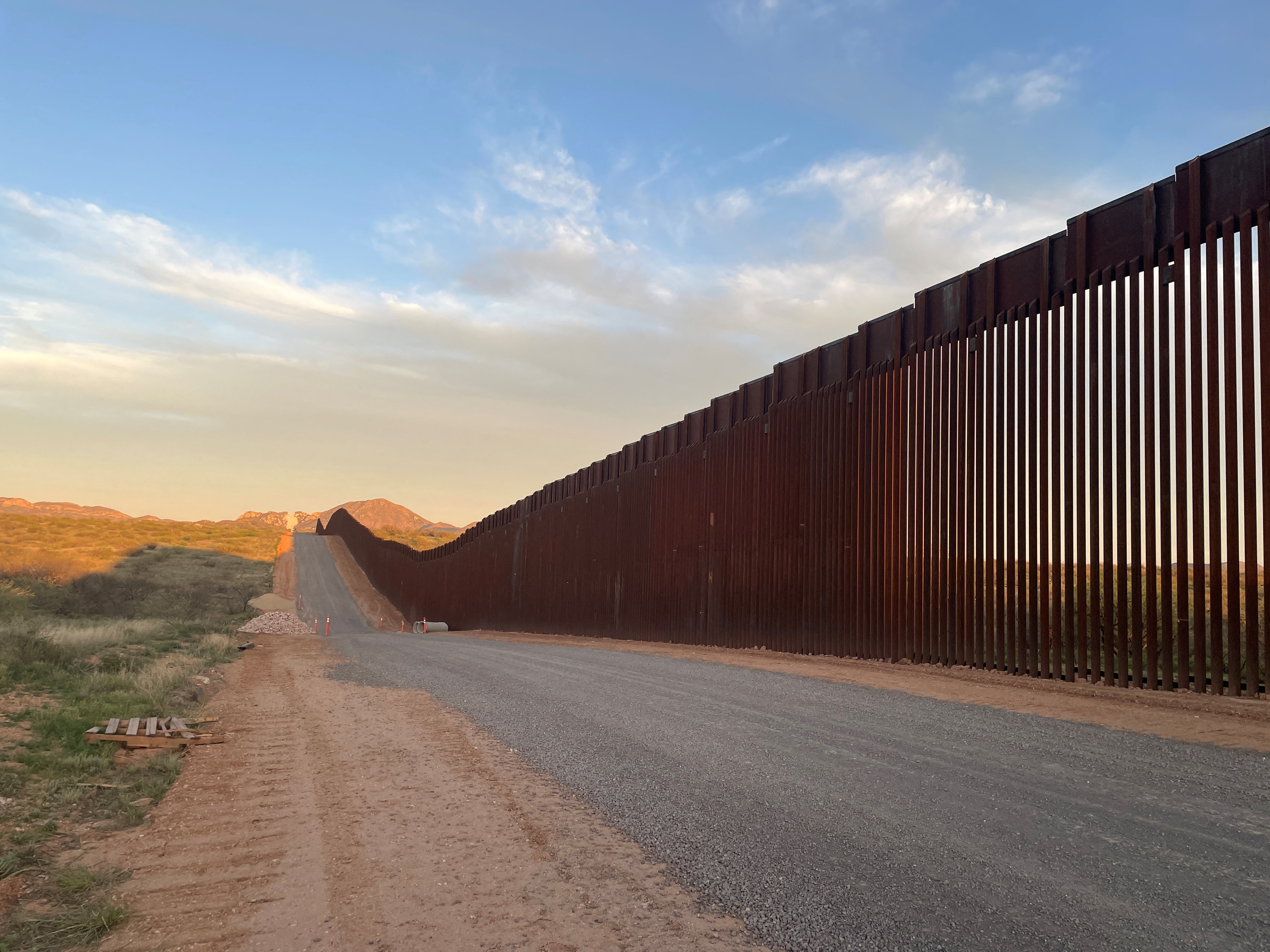 Humanitarian group aids migrants at U.S.-Mexico border wall near Sasabe, Arizona