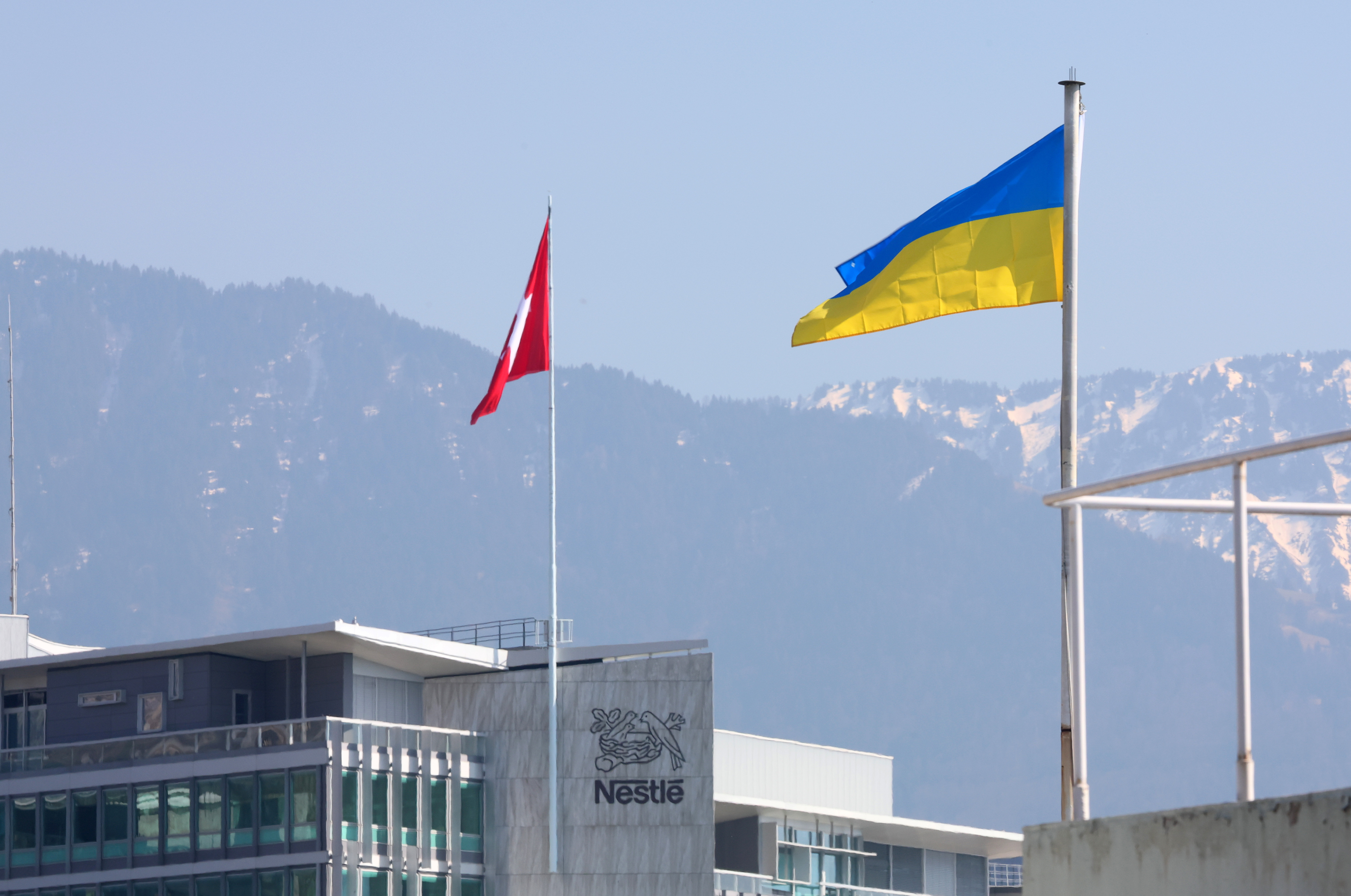 The flag of Ukraine is pictured in front of the headquarters of food giant Nestle in Vevey