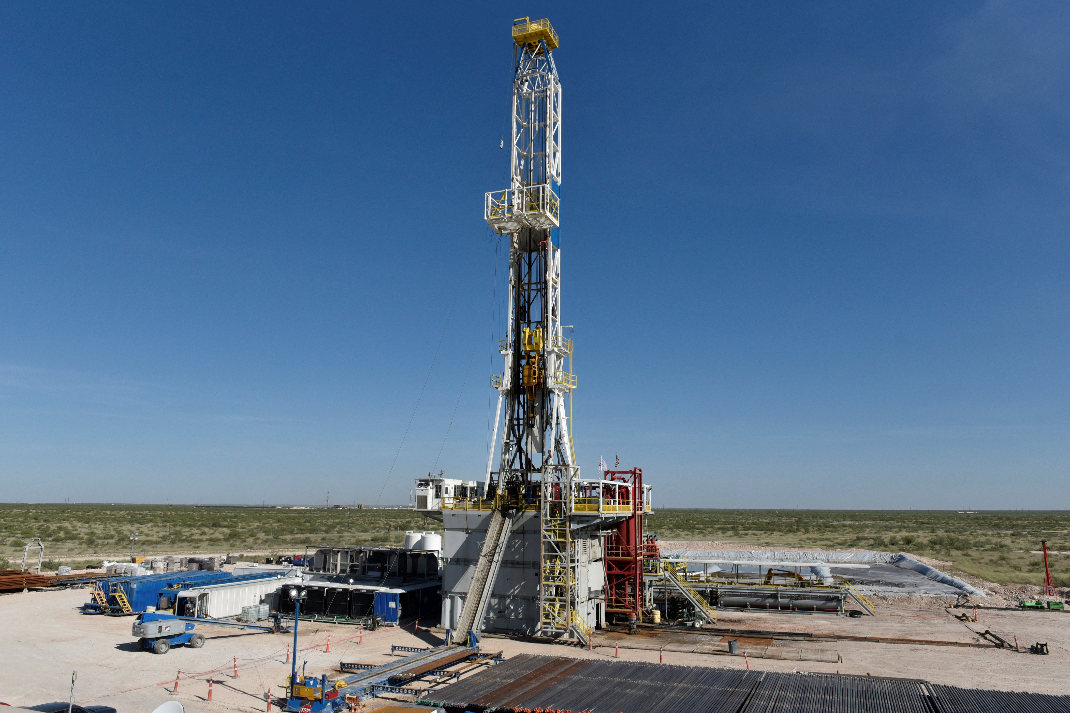 A drilling rig on a lease owned by Oasis Petroleum operates in the Permian Basin oil and natural gas production area near Wink