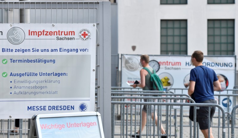 People arrive to receive a vaccine against COVID-19 at a centre at in Dresden, Germany