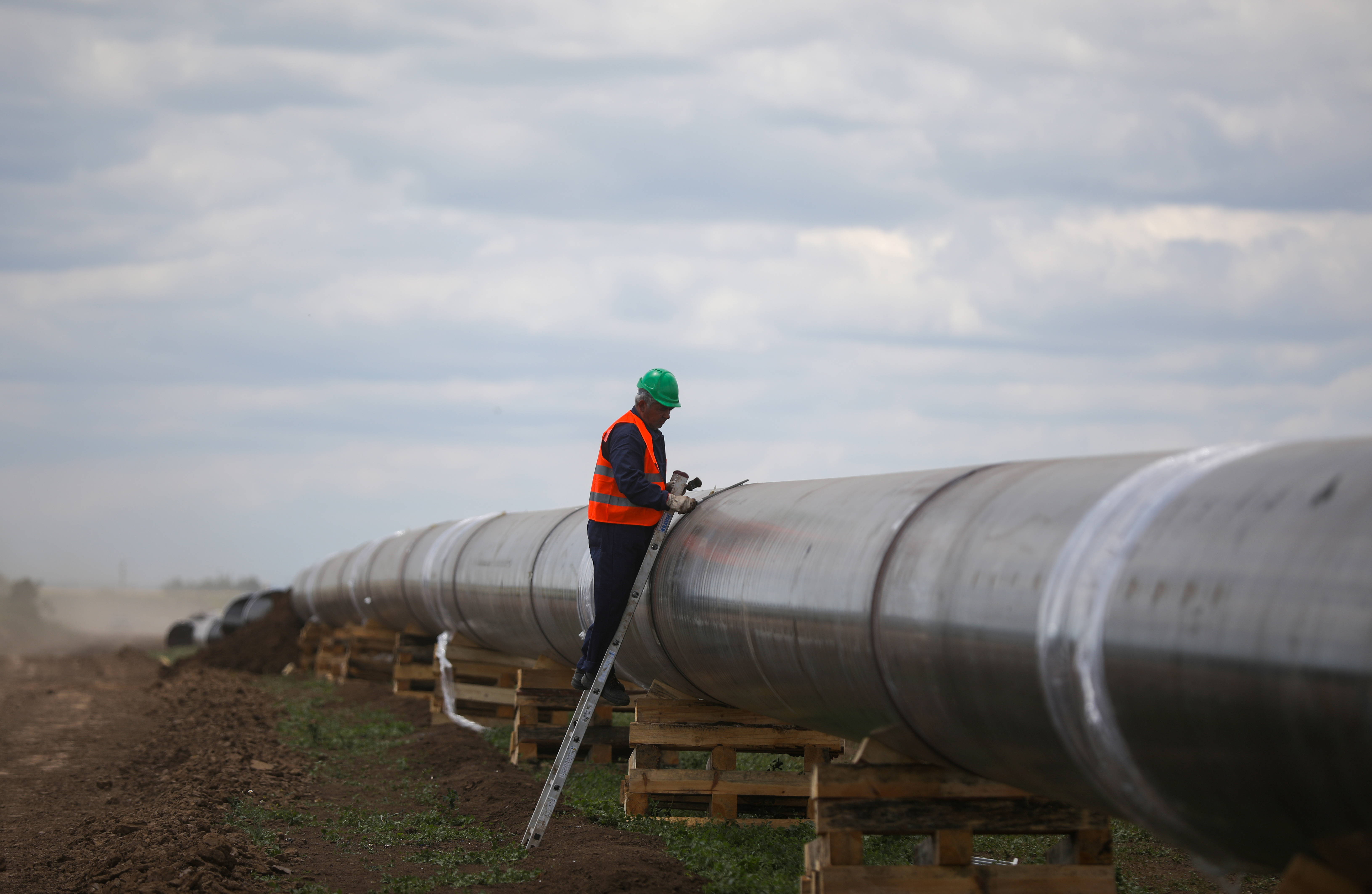 A worker is seen next to a pipe at a construction site on the extension of Russia's TurkStream pipeline after a visit of Serbia's President Vucic and Bulgaria's PM Borissov ,in Letnitsa