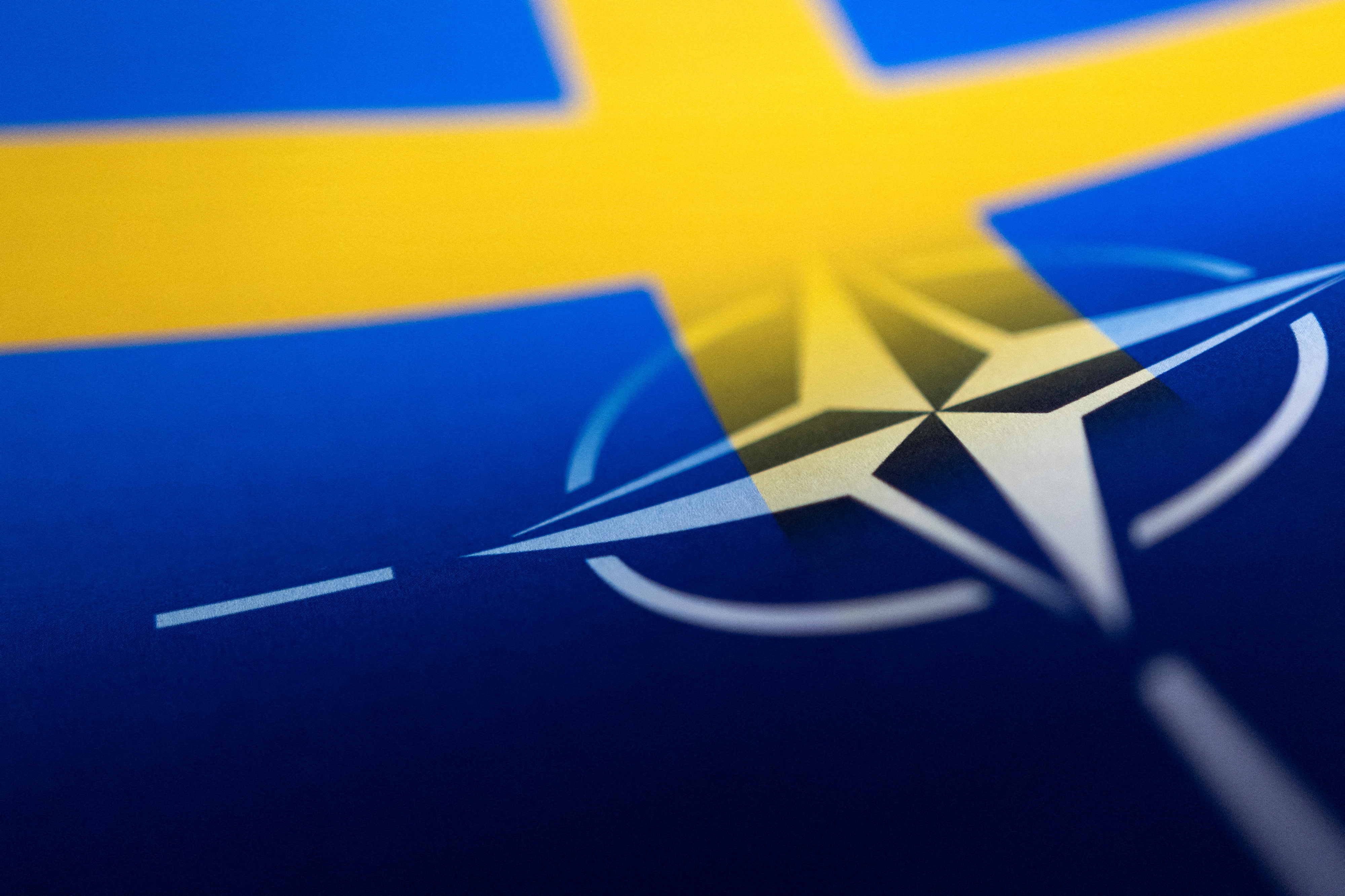 Illustration shows Swedish and NATO flags