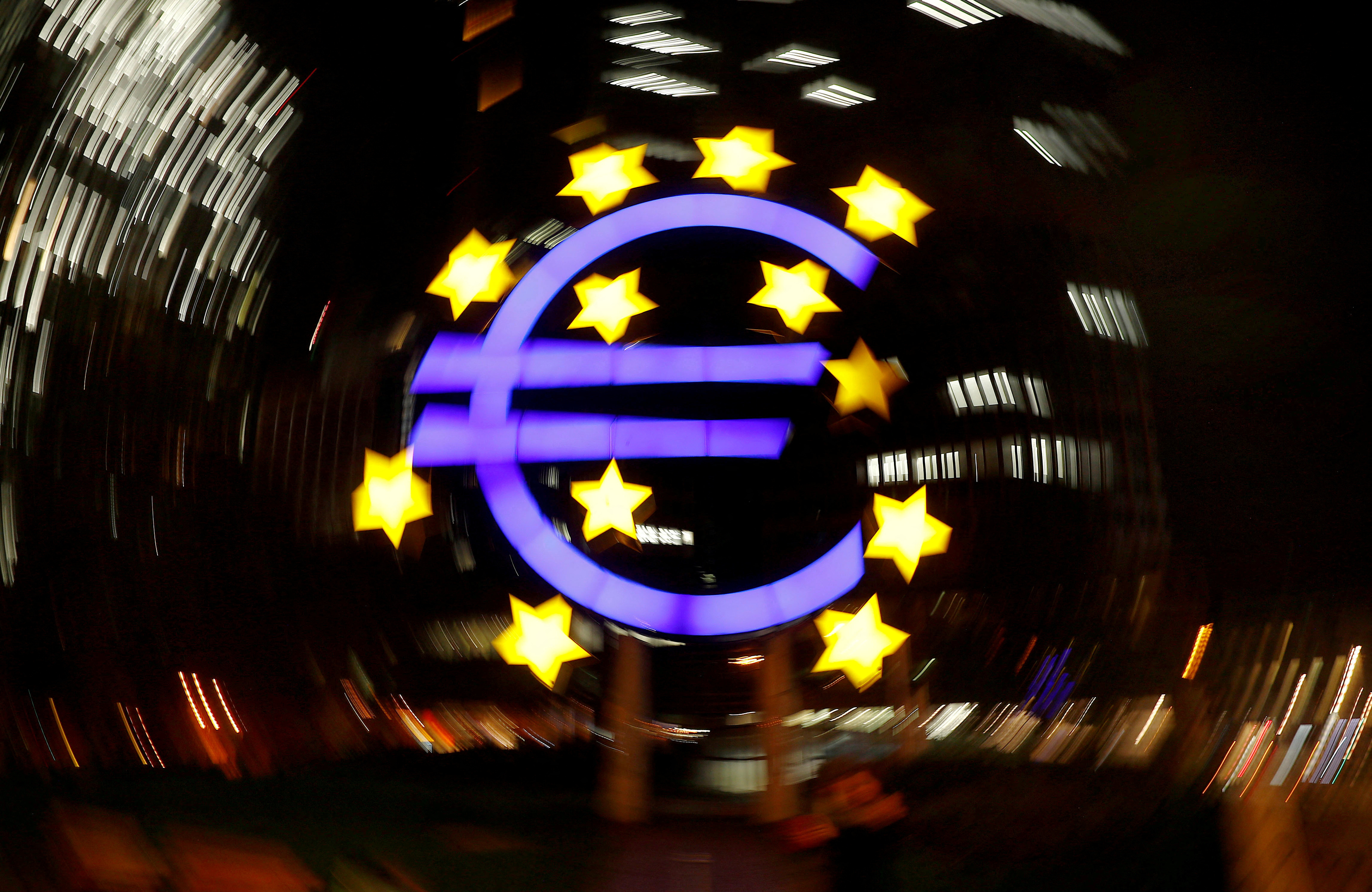 The euro sign is photographed in front of the former head quarter of the European Central Bank in Frankfurt