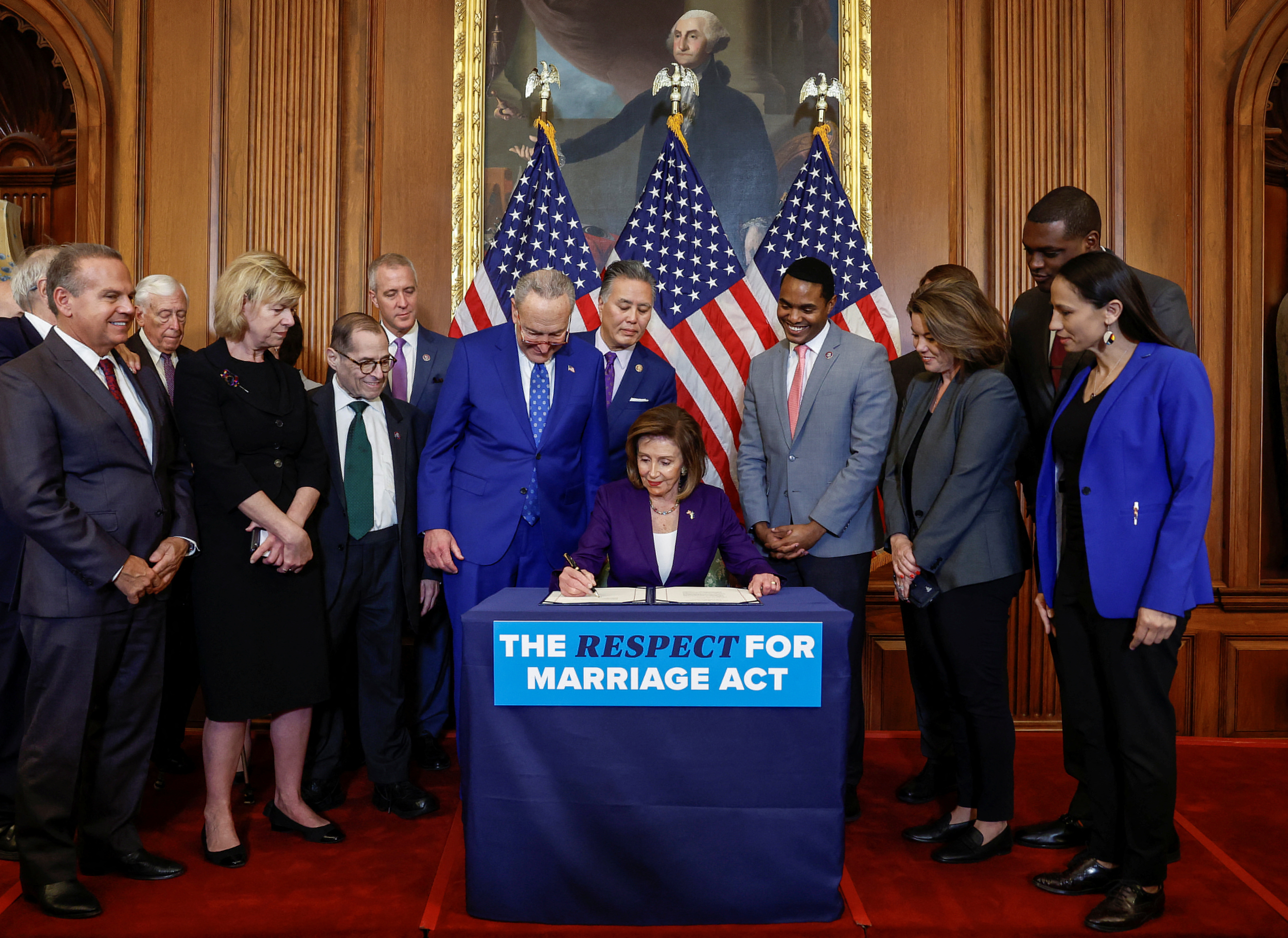 US House Speaker, Nancy Pelosi, signs 