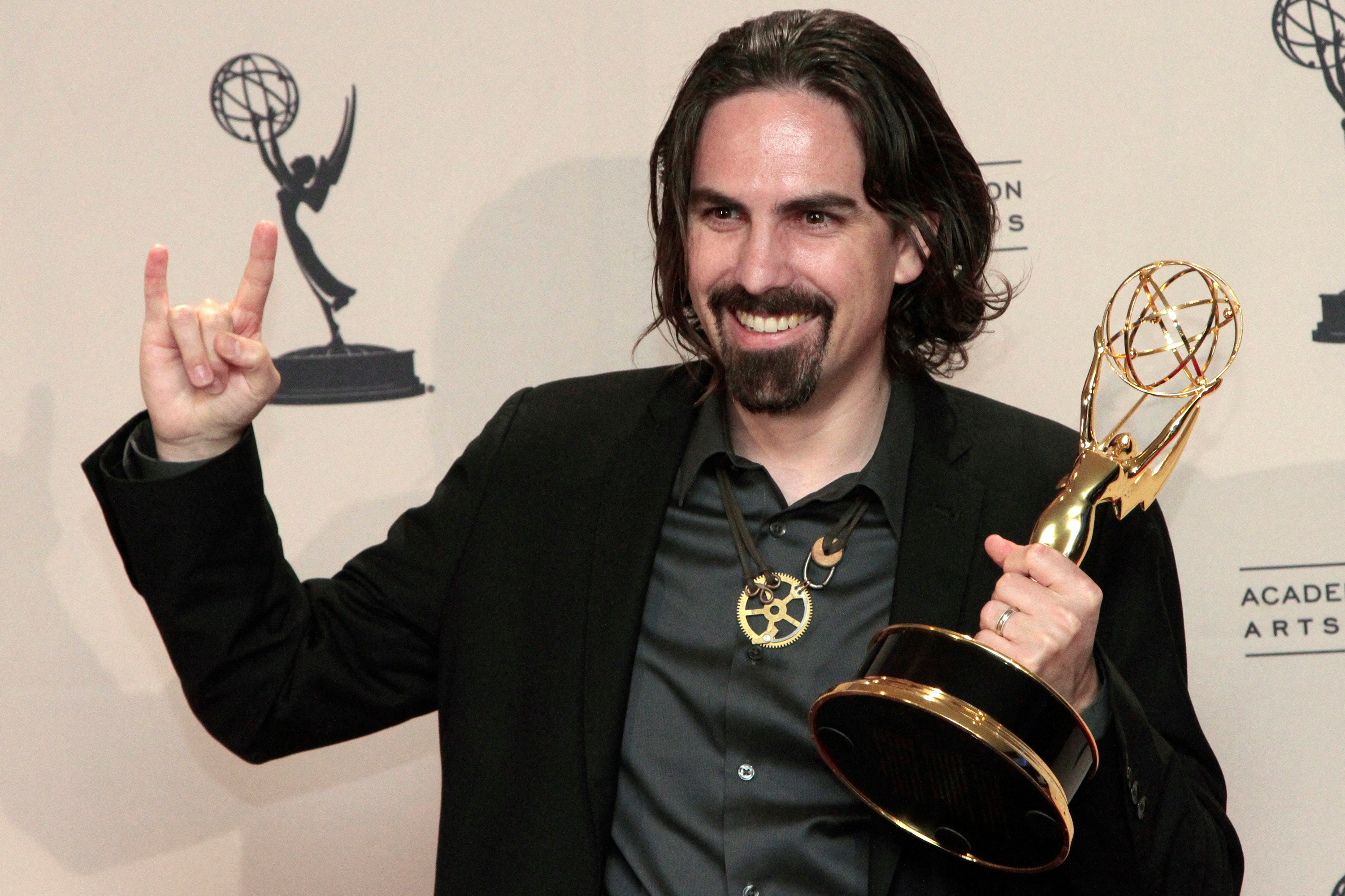 McCreary poses with the Emmy for outstanding original main title theme music for 