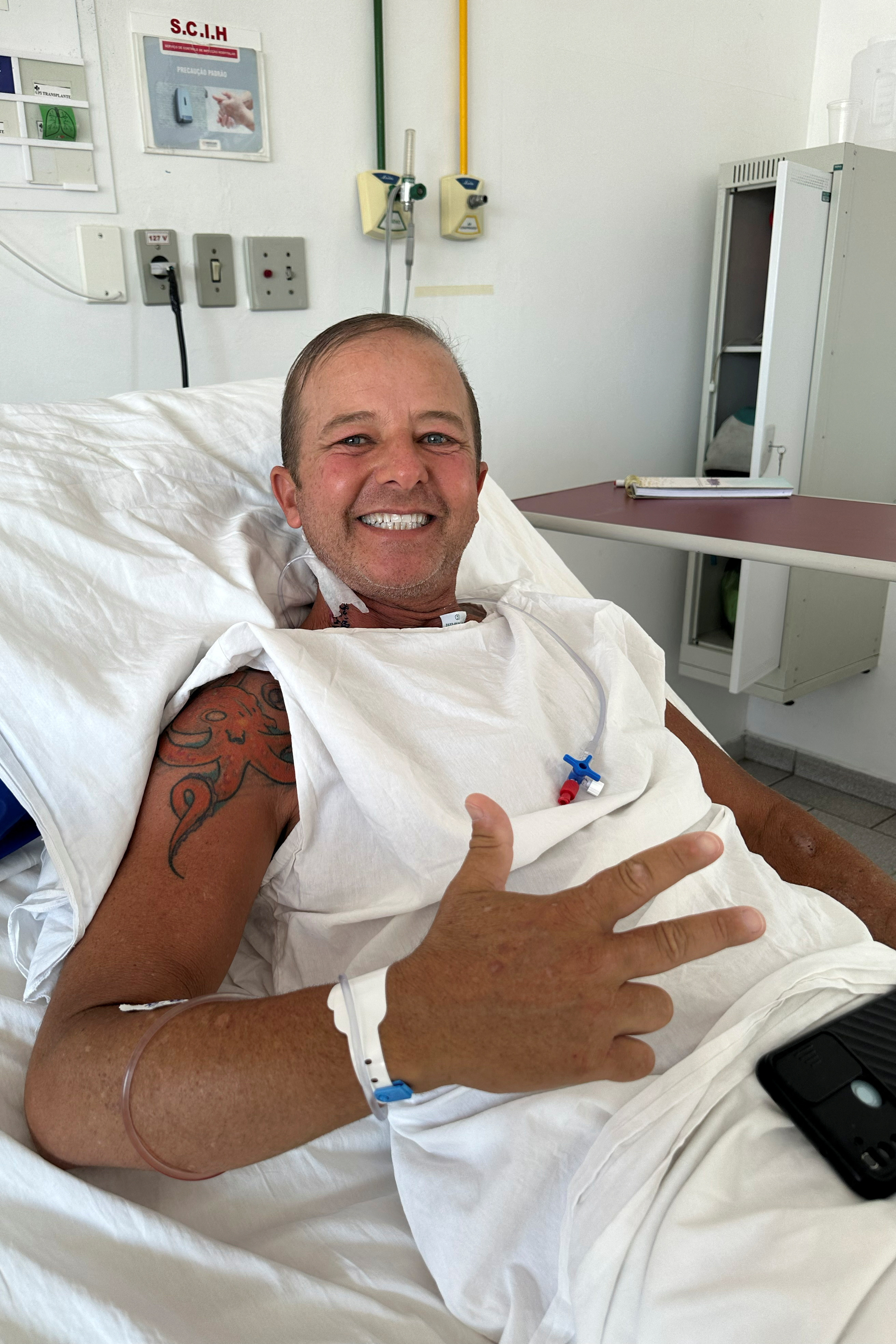 Patient Ricardo Medeiros de Oliveira reacts after a kidney transplant at the hospital Santa Casa de Juiz de Fora