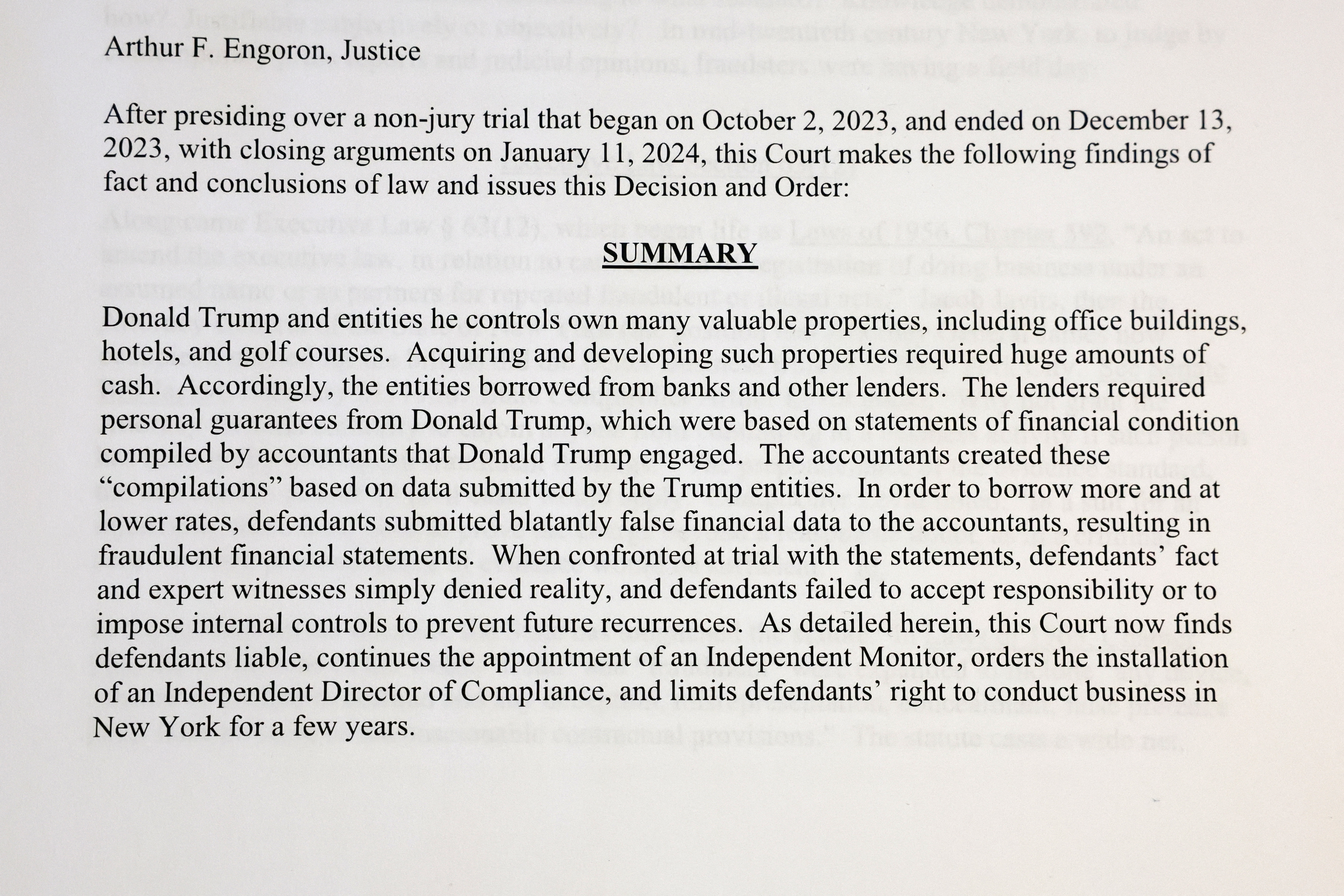 A printed page from Judge Arthur Engoron’s ruling against former U.S. President Donald Trump is photographed in New York