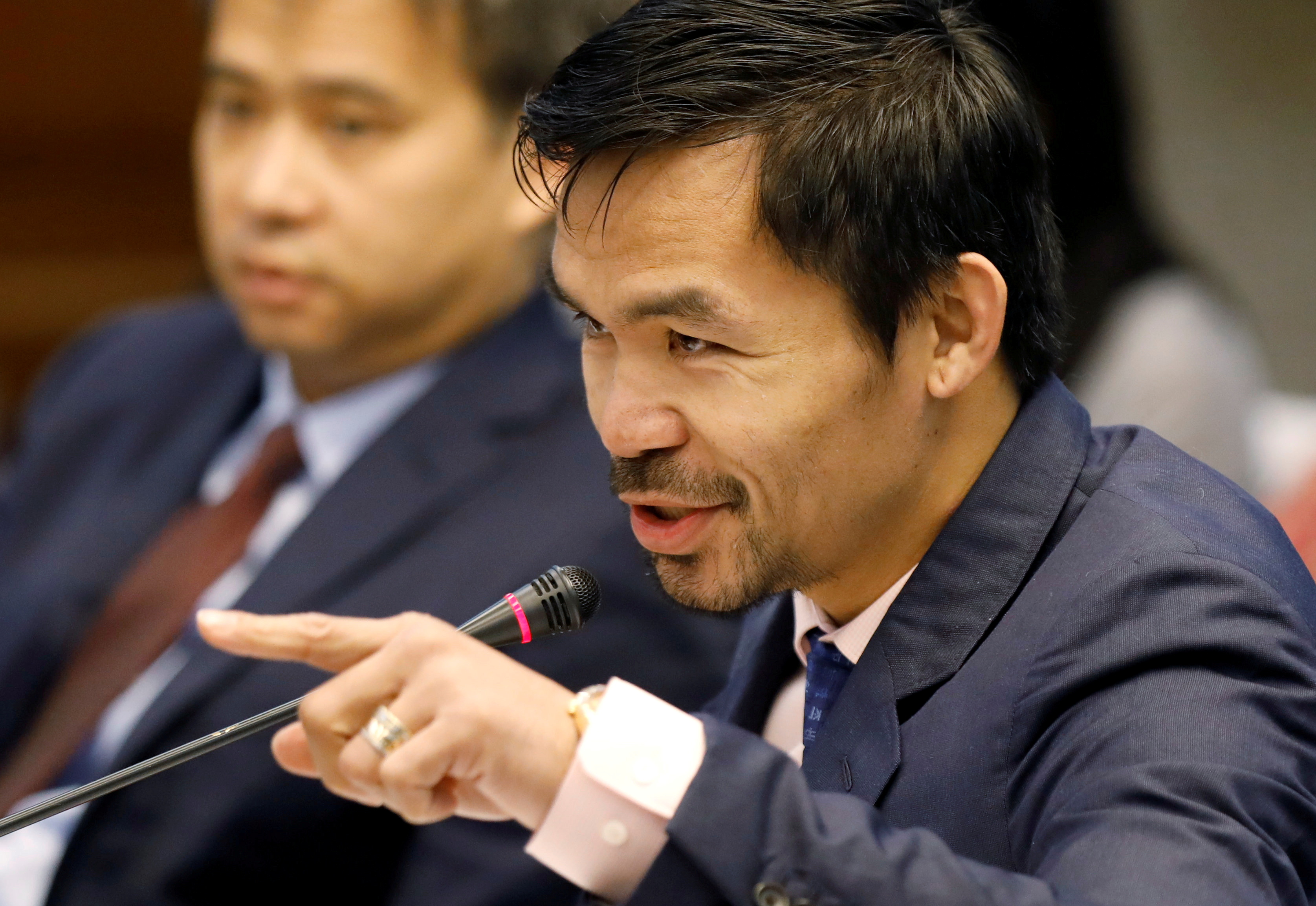 Pacquiao questions Lascanas during a Senate inquiry on alleged extra judicial killings, in Manila