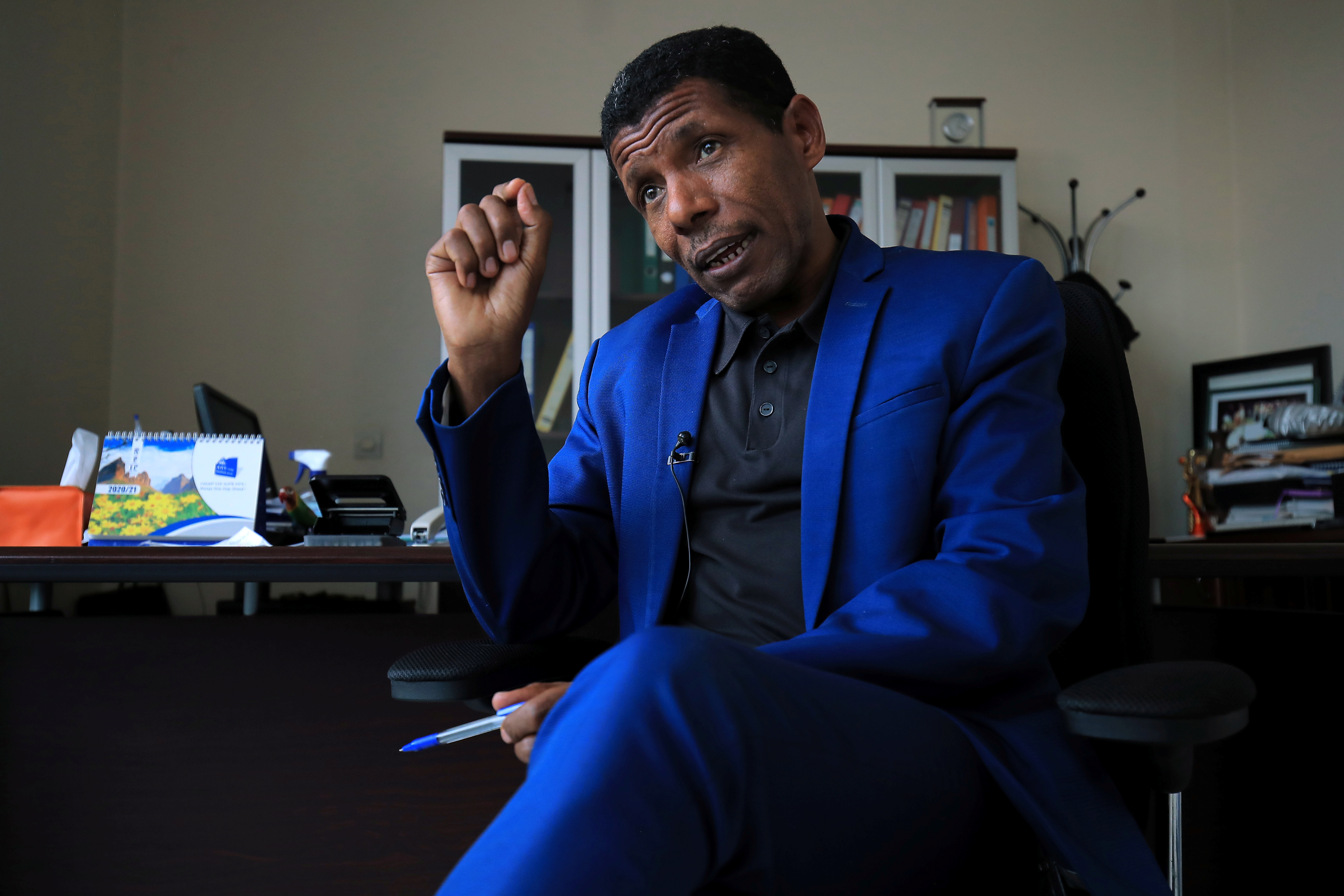 Haile Gebrselassie, Ethiopian Olympic gold medallist and national hero, speaks during a Reuters interview, after pledging to join the fight against rebellious forces, at his office in Addis Ababa, Ethiopia November 24, 2021. REUTERS/Tiksa Negeri