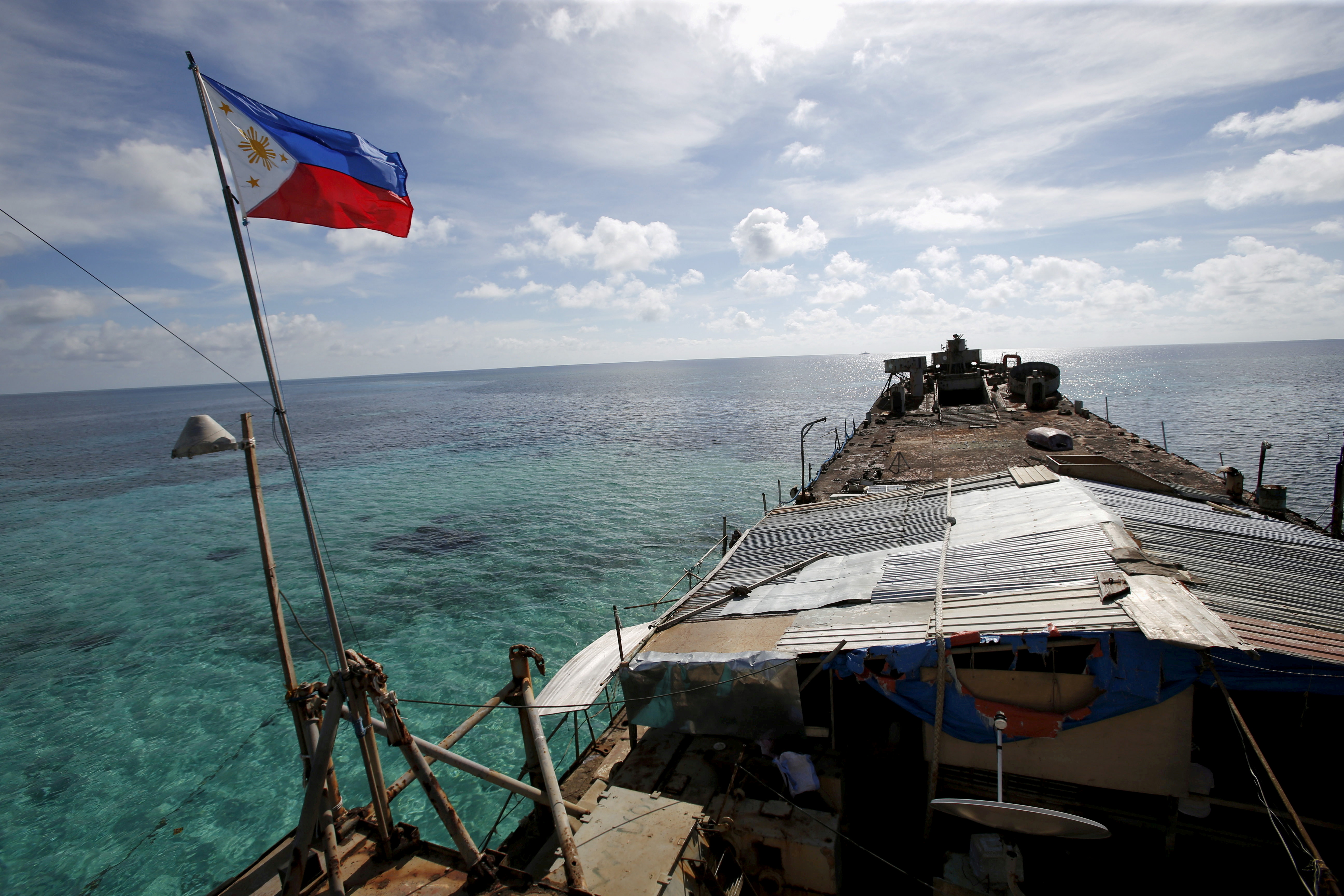 A Philippine flag flutters from BRP Sierra Madre, a dilapidated Philippine Navy ship that has been aground since 1999 and became a Philippine military detachment on the disputed Second Thomas Shoal