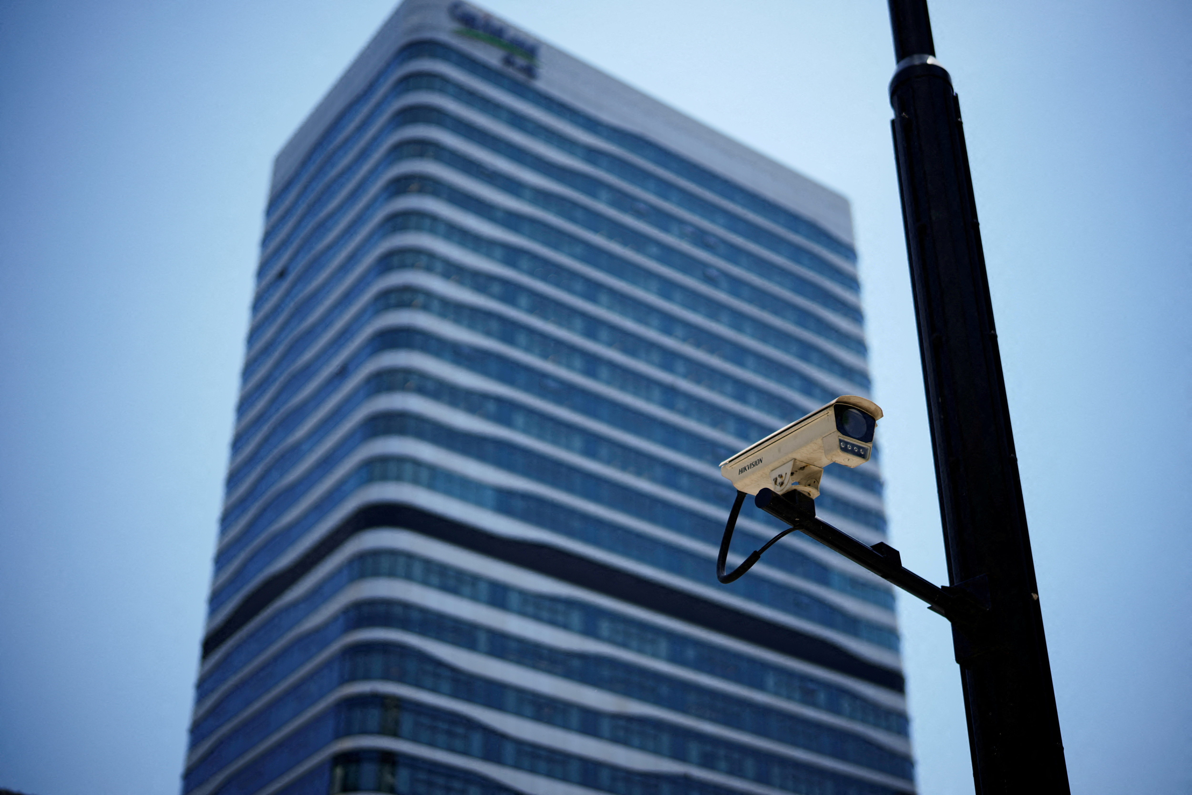 A surveillance camera is seen in front of an office building, where the office of Capvision is located, in Shanghai