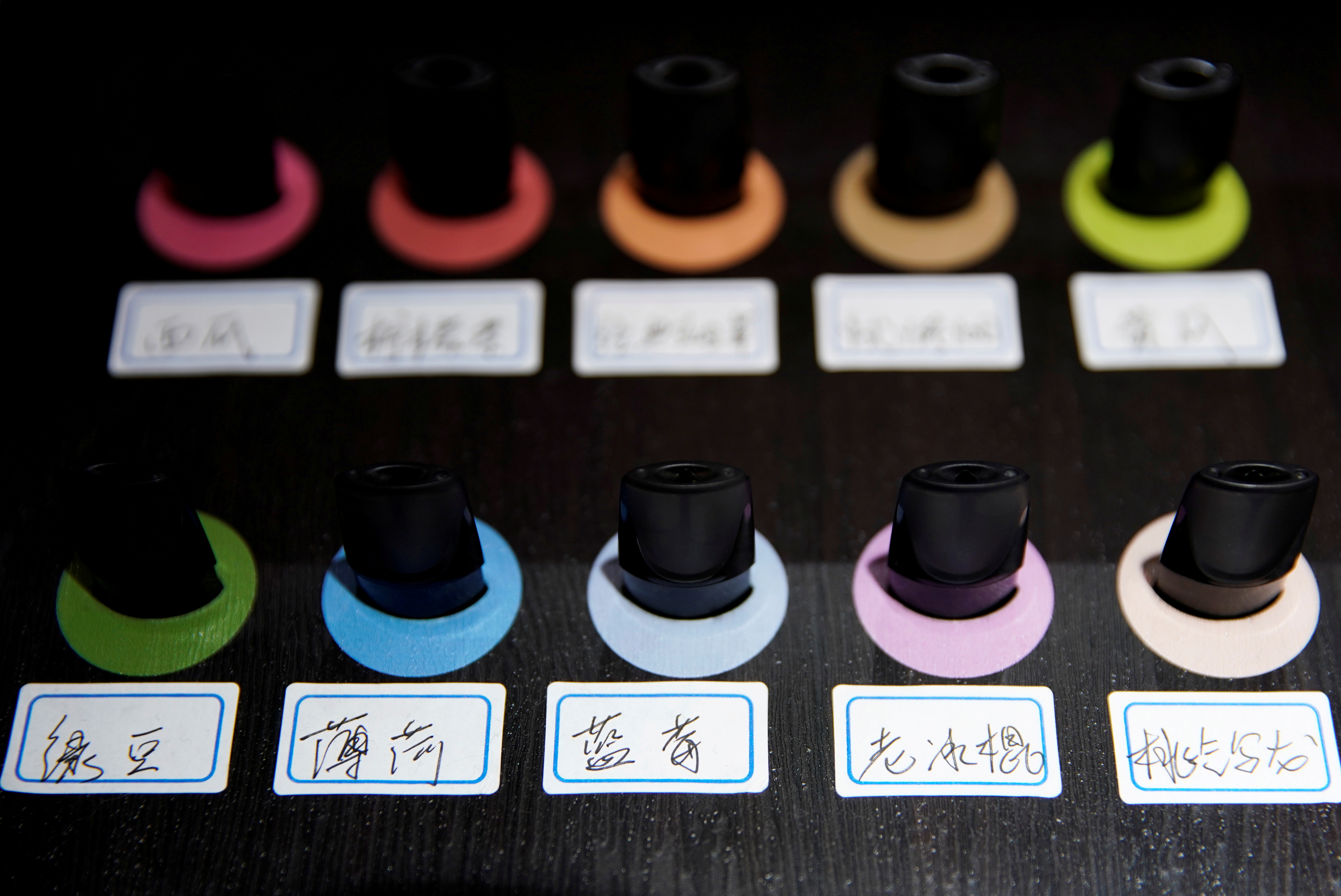 Pods of different flavors are seen on display at an authorized reseller store of Chinese e-cigarette company Relx in Shanghai