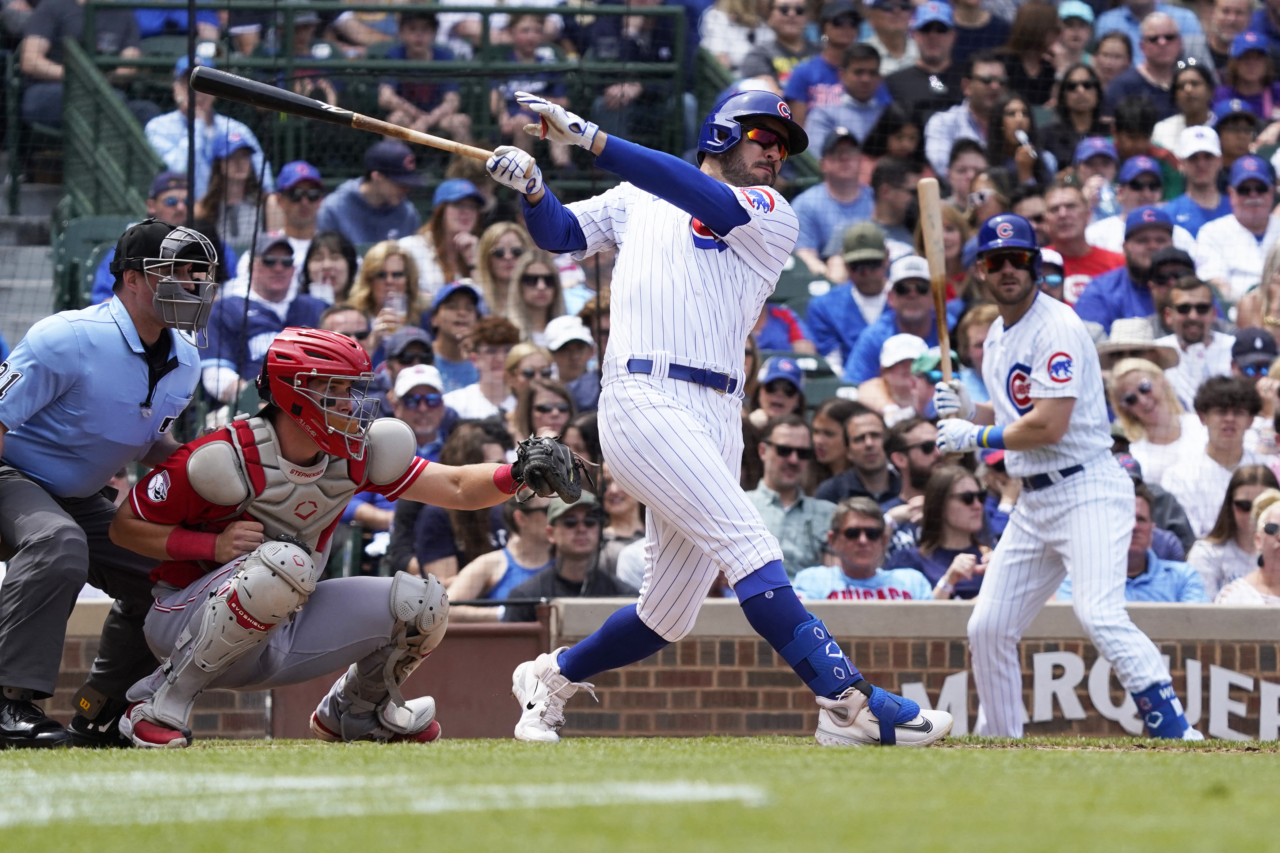 Hot-hitting Reds earn road sweep over Cubs