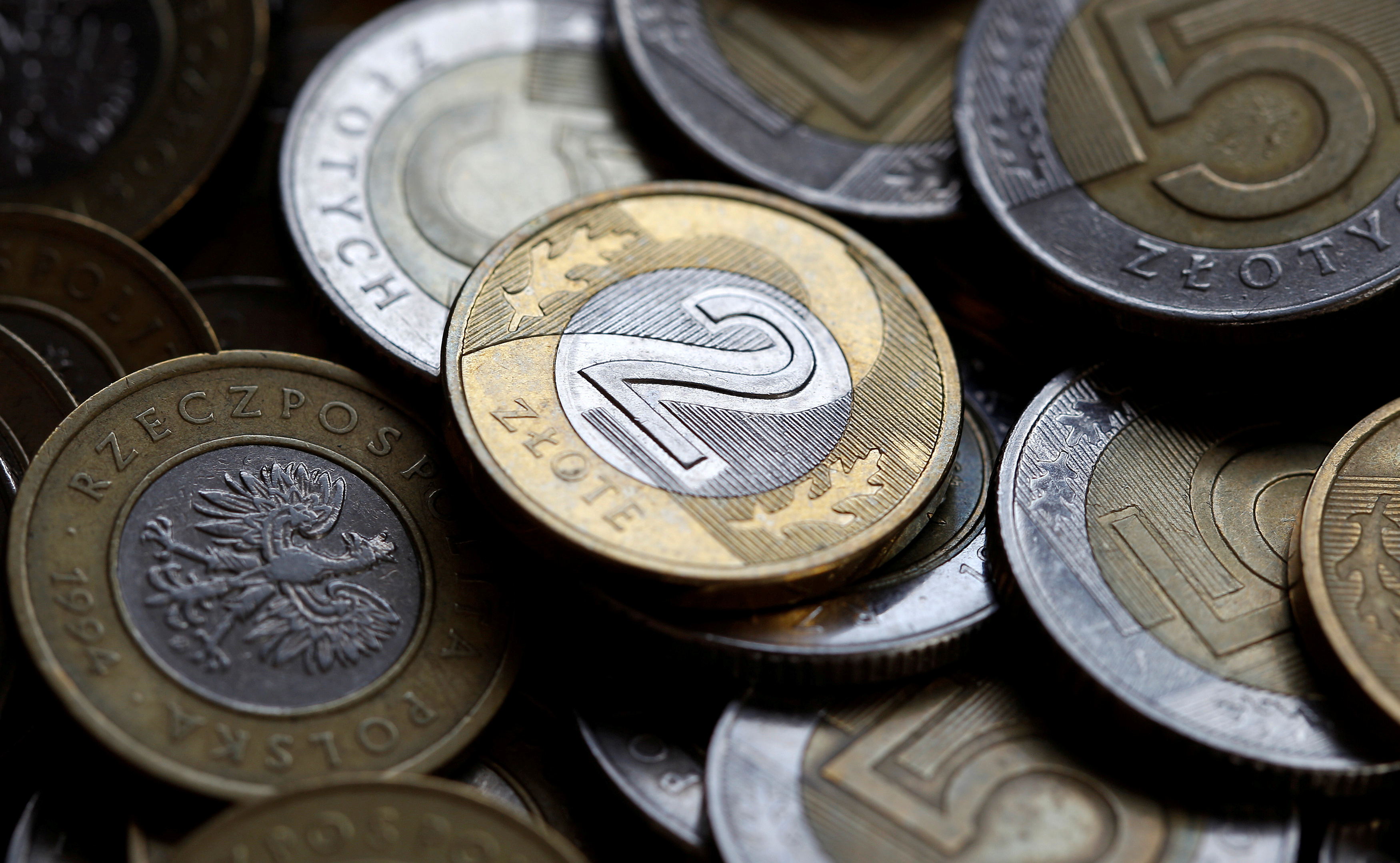 Polish currency zloty coins are seen in this photo illustration taken in Warsaw
