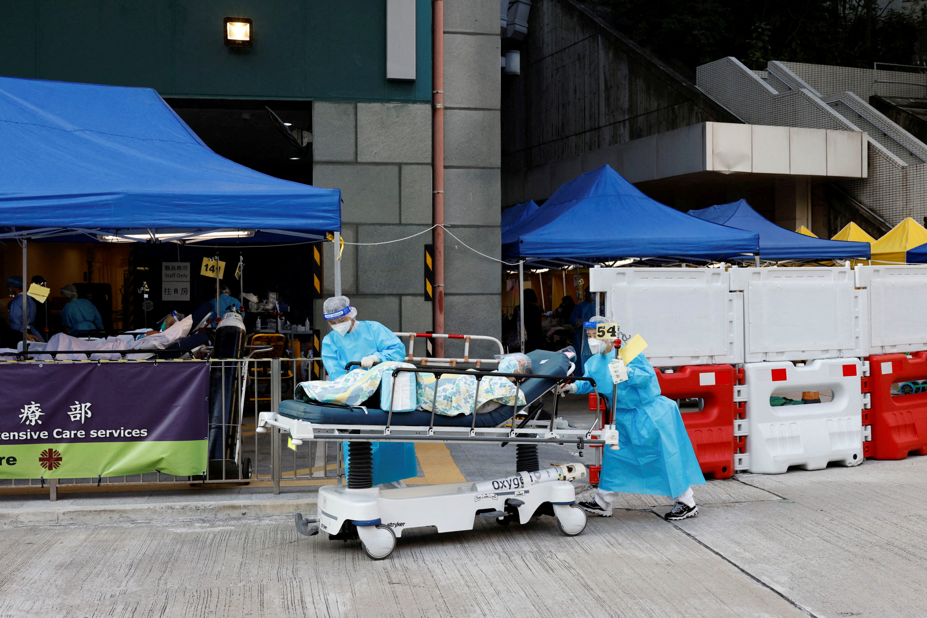 Hong Kong facilities for storing dead bodies stretched as COVID deaths ...