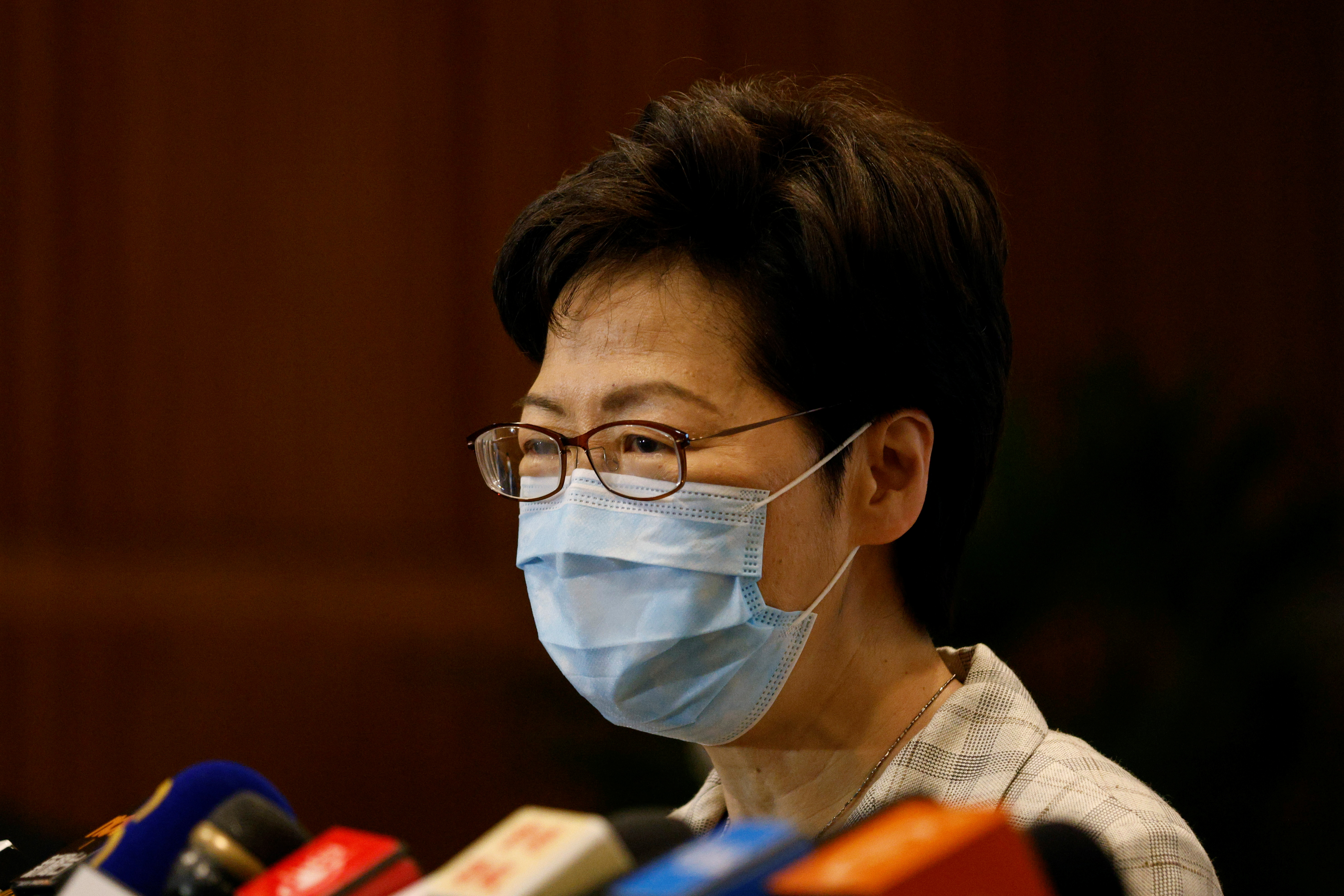 Hong Kong Chief Executive Carrie Lam speaks to media at polling station during voting of the election committee, in Hong Kong, China, September 19, 2021. REUTERS/Tyrone Siu