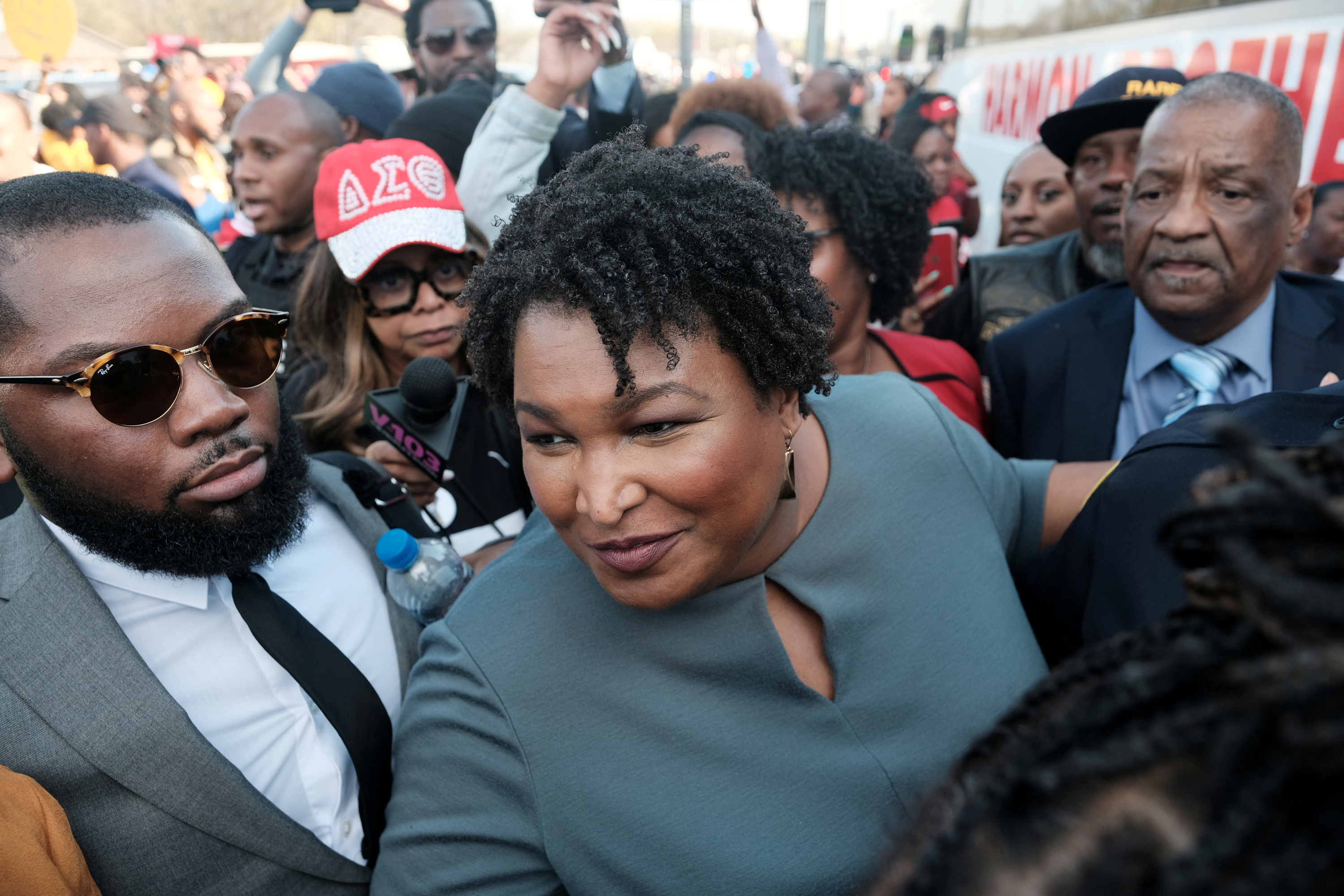 Stacey Abrams speaks with member of the press after crossing the the Edmund Pettus Bridge commemorating the 55th anniversary of the 