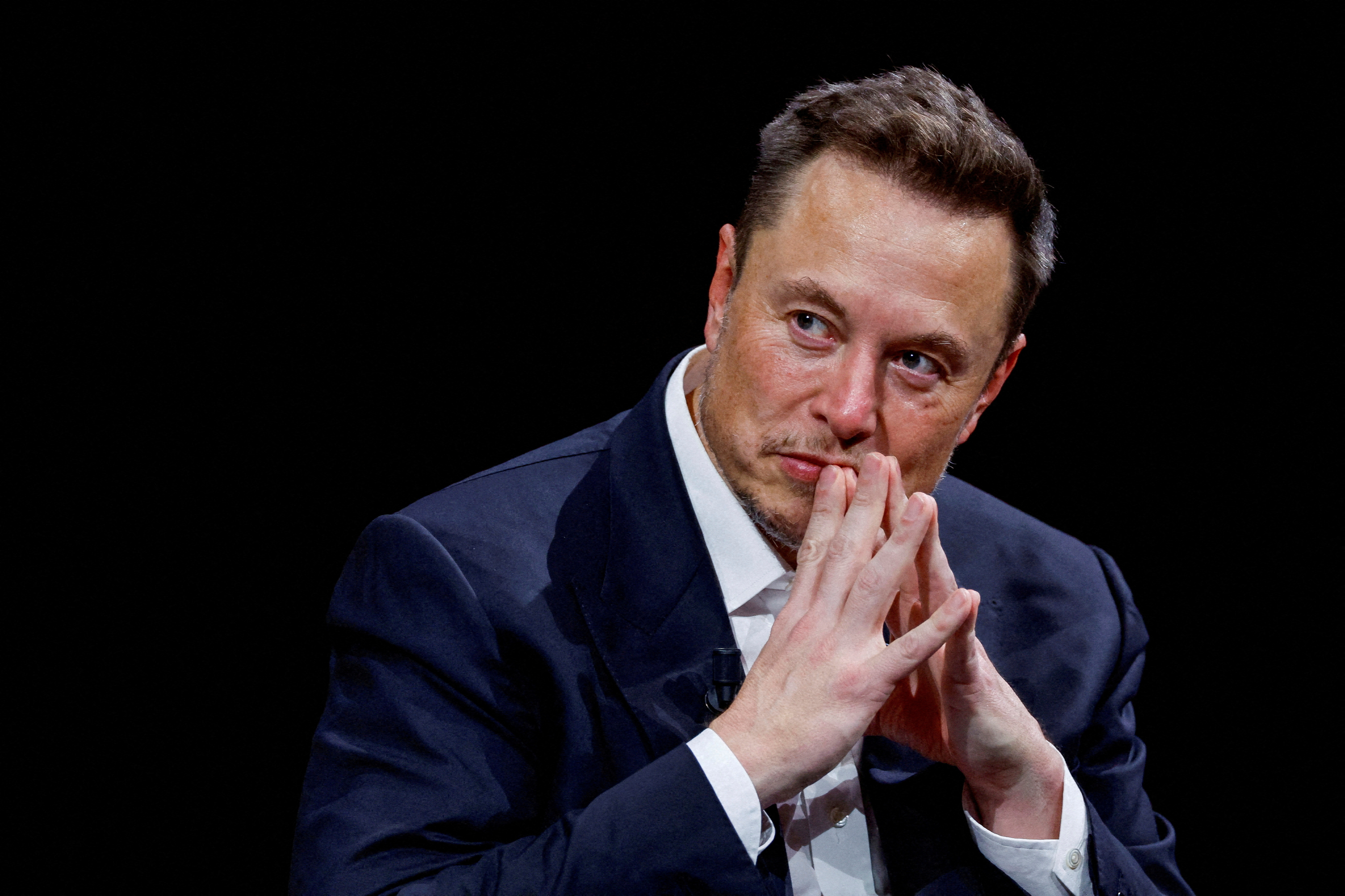 Elon Musk, owner of X, formerly Twitter, gestures as he attends a conference in Paris in June 2023. REUTERS/Gonzalo Fuentes/
