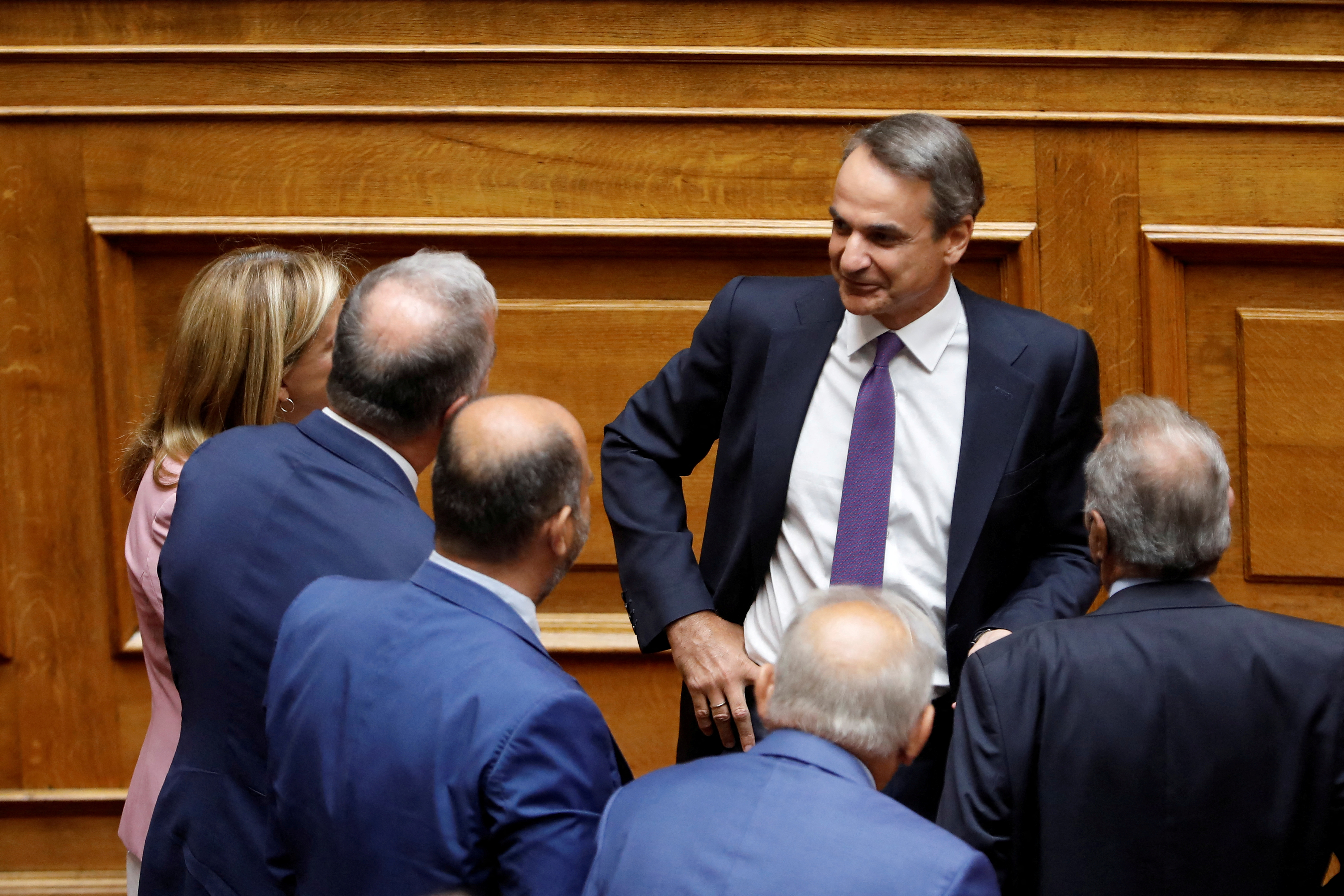 Greek PM Mitsotakis addresses lawmakers during a parliamentary on a wiretapping case in Athens