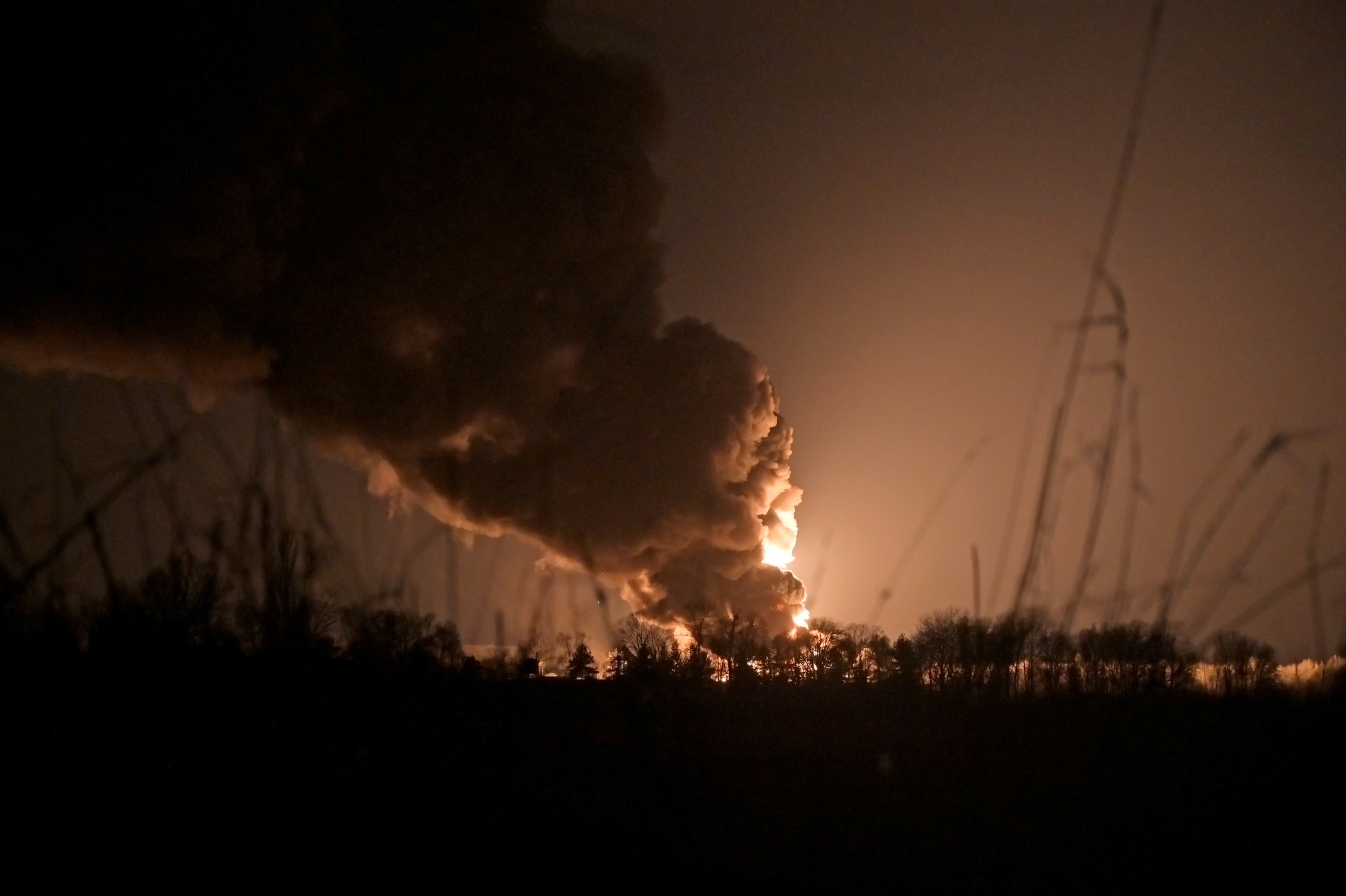 A view shows a burning oil depot reportedly hit by shelling near the military airbase Vasylkiv in the Kyiv region