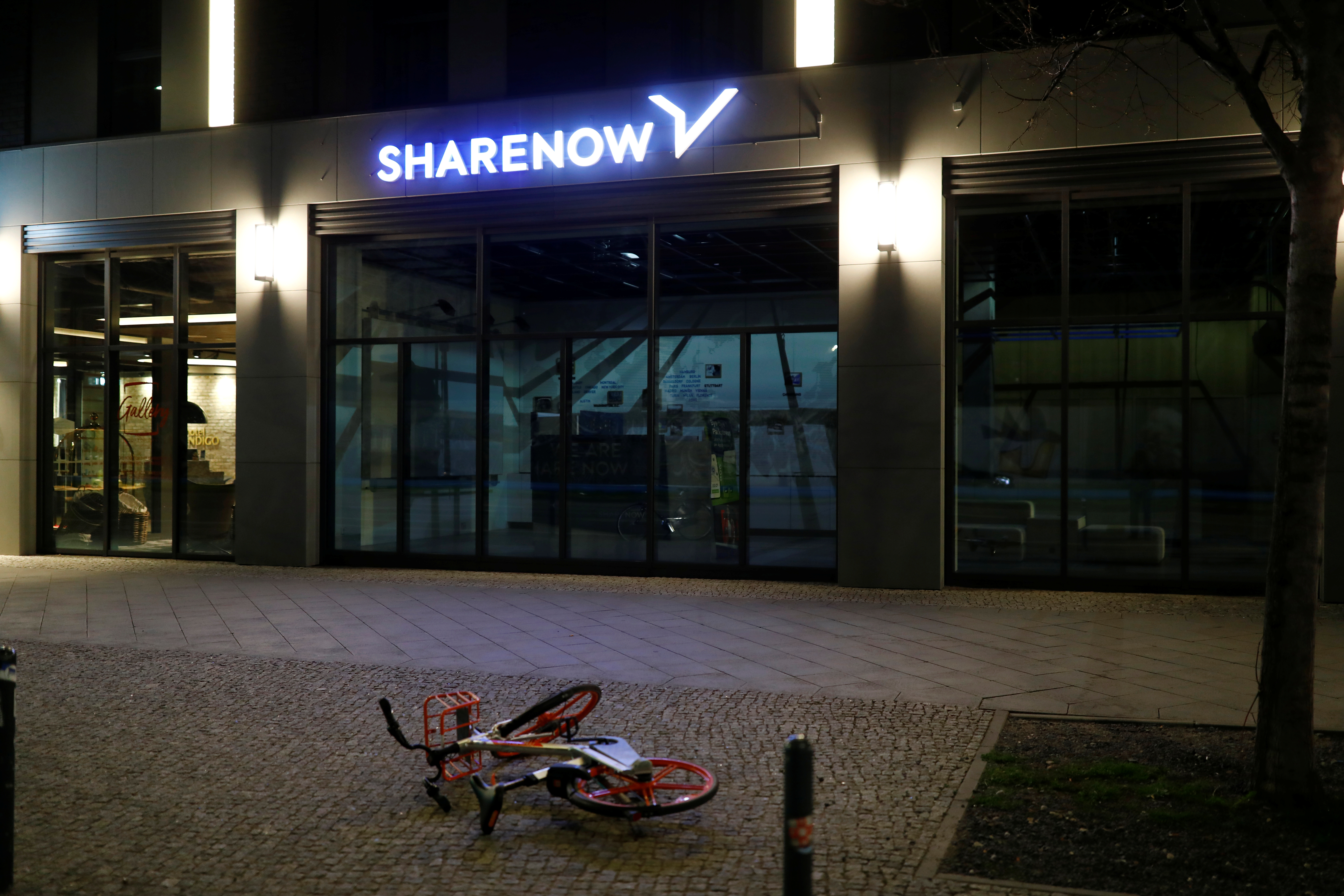 Sharing bike lies in front of an office of the car-sharing company SHARE NOW in the Kreuzberg district of Berlin