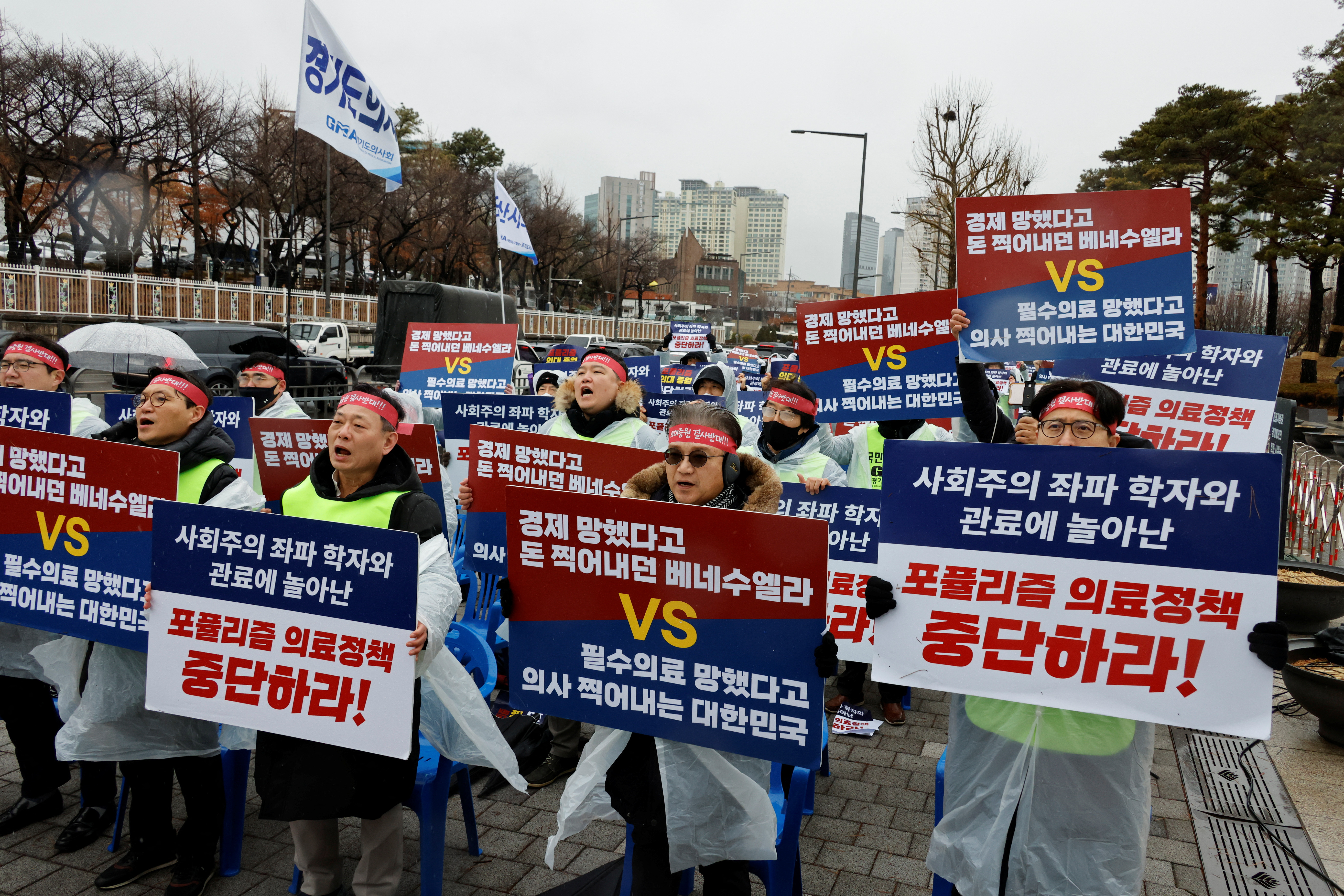 Doctors and Medical workers take part in a protest against a plan to admit more students to medical school, in Seoul