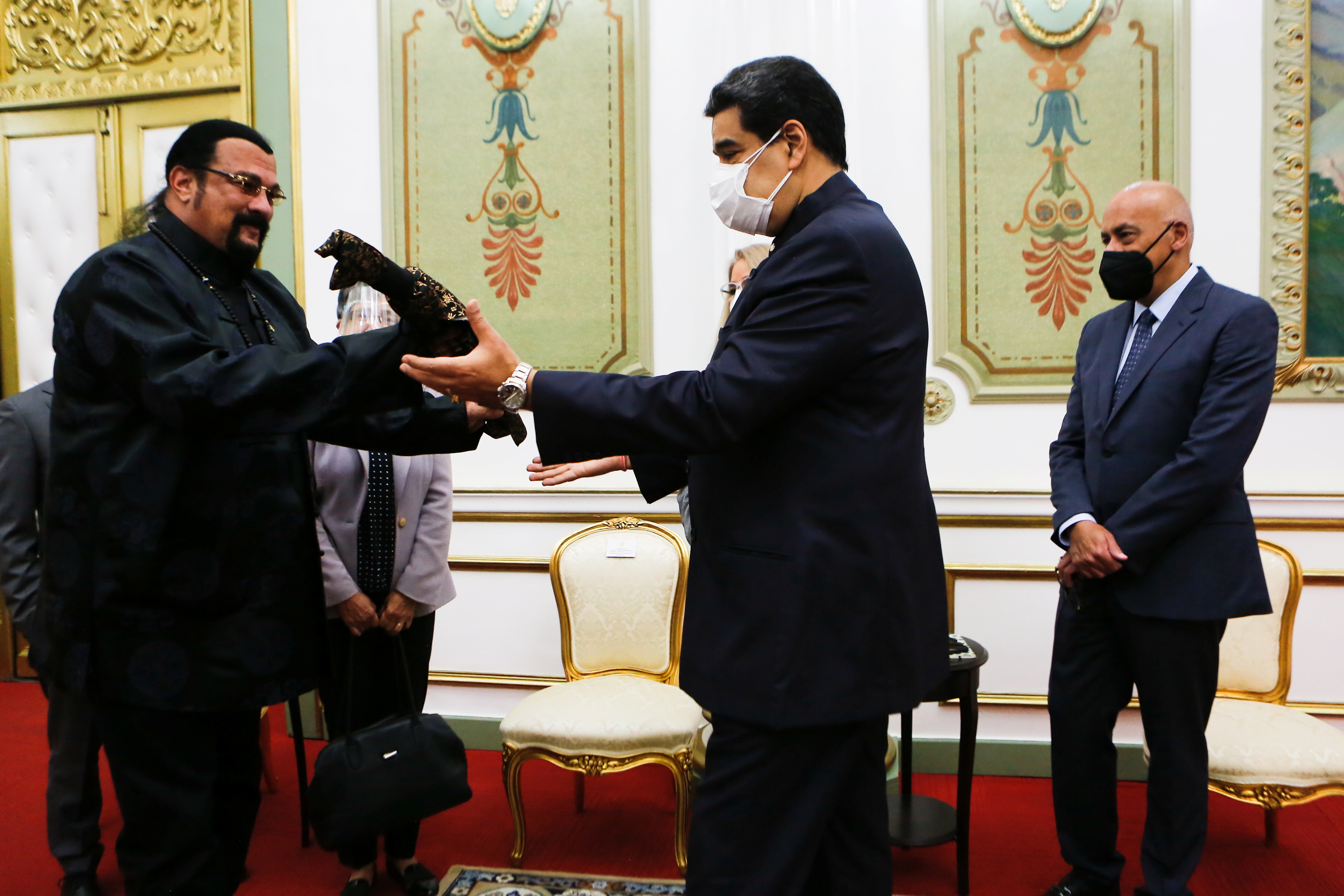 Venezuela's President Nicolas Maduro receives a samurai sword as a gift from actor Steven Seagal, in Caracas