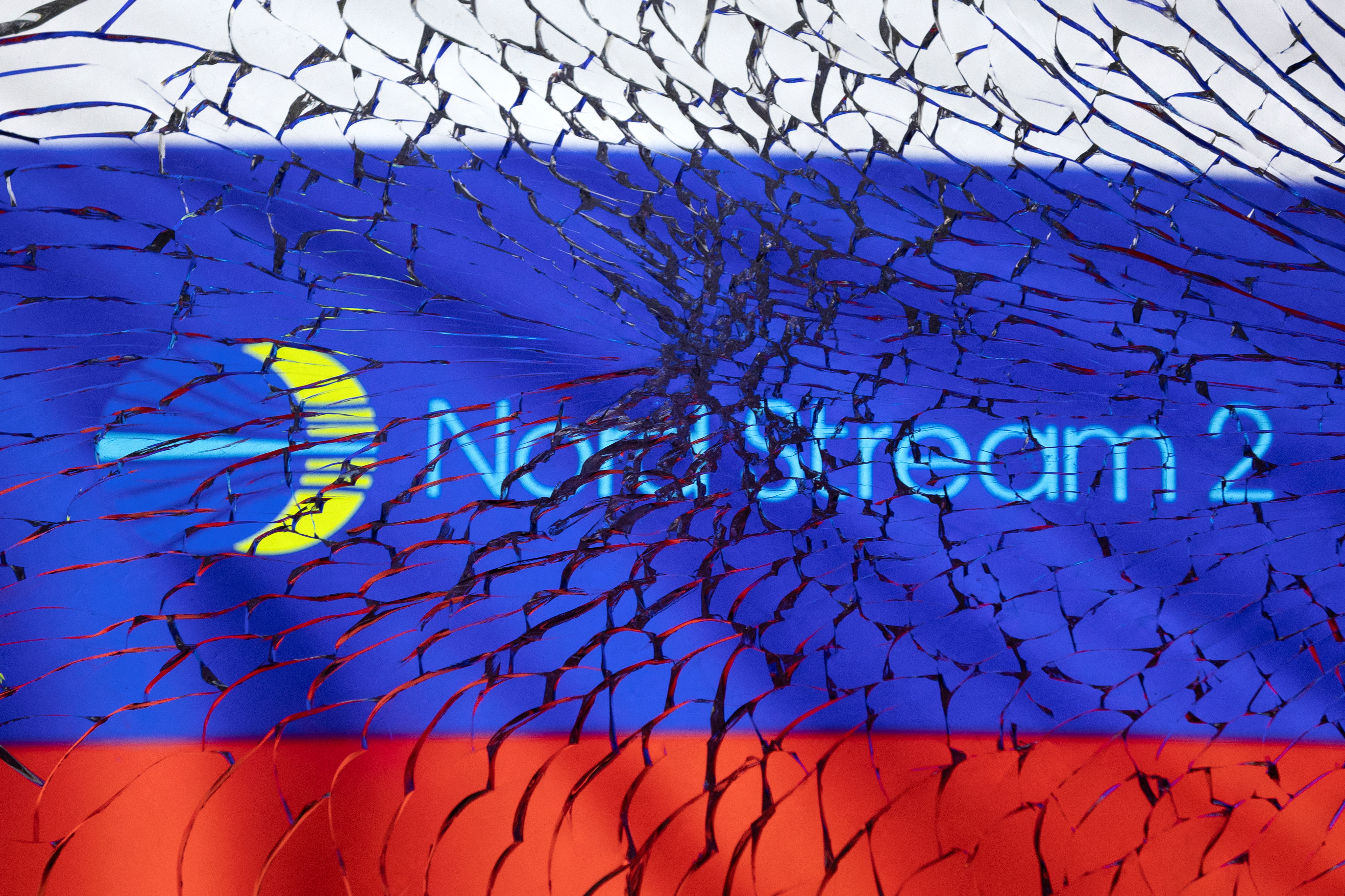 Illustration shows Nord Stream 2 logo and Russian flag through broken glass