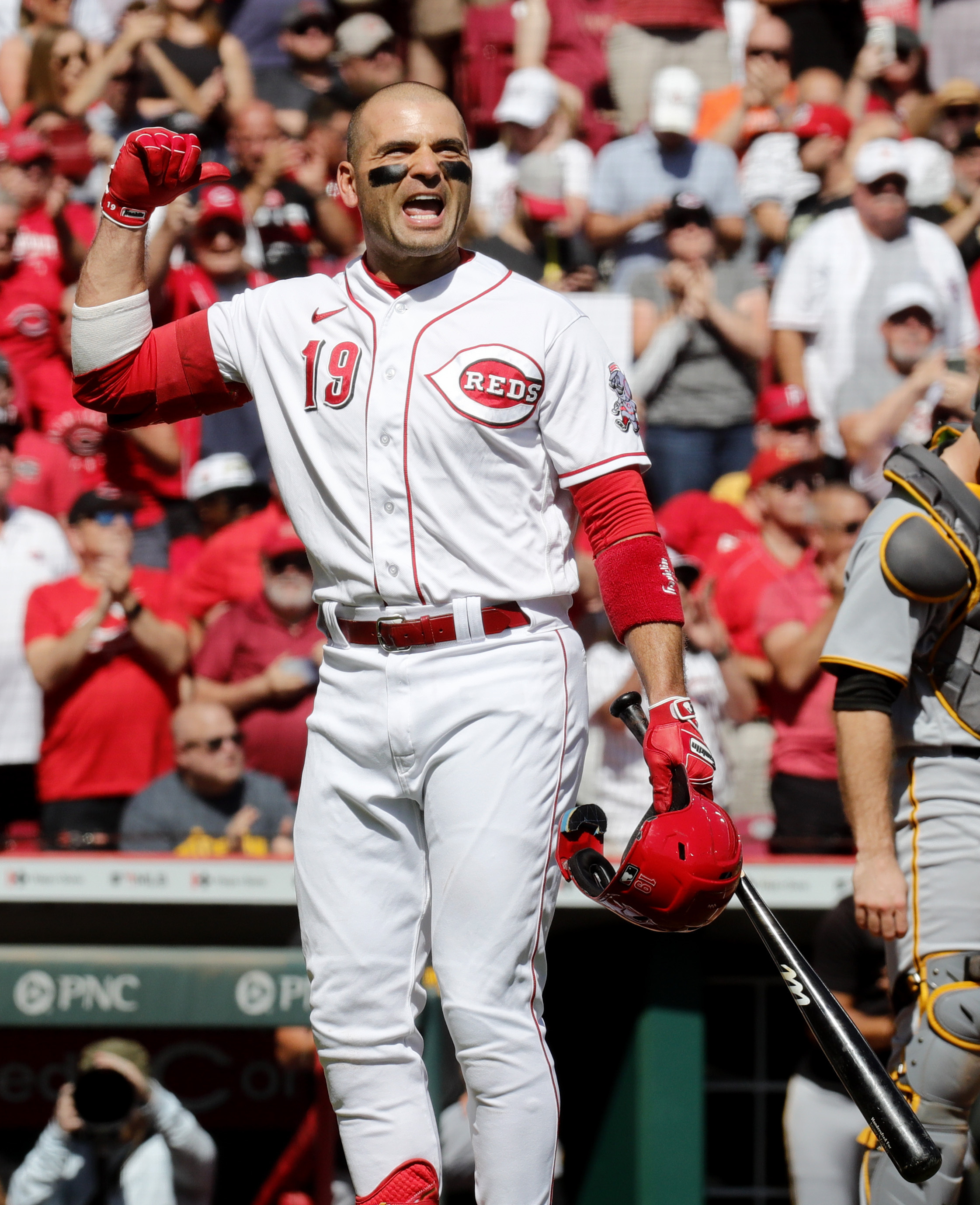 Reds bounce back, rally for win over Pirates as they chase Wild Card