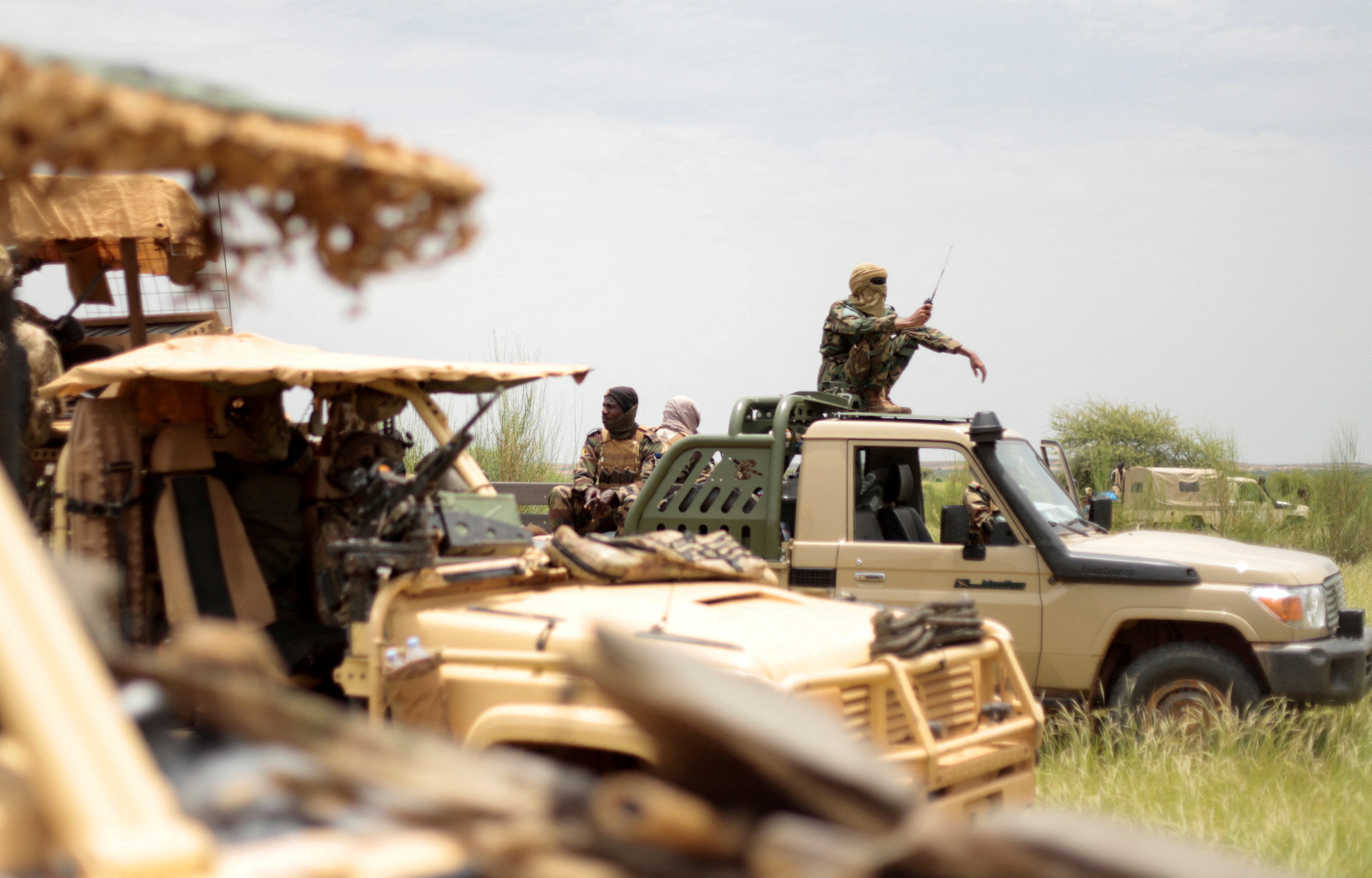 A Malian soldiers patrol with soldiers from the new Takuba force near Niger border in Dansongo Circle