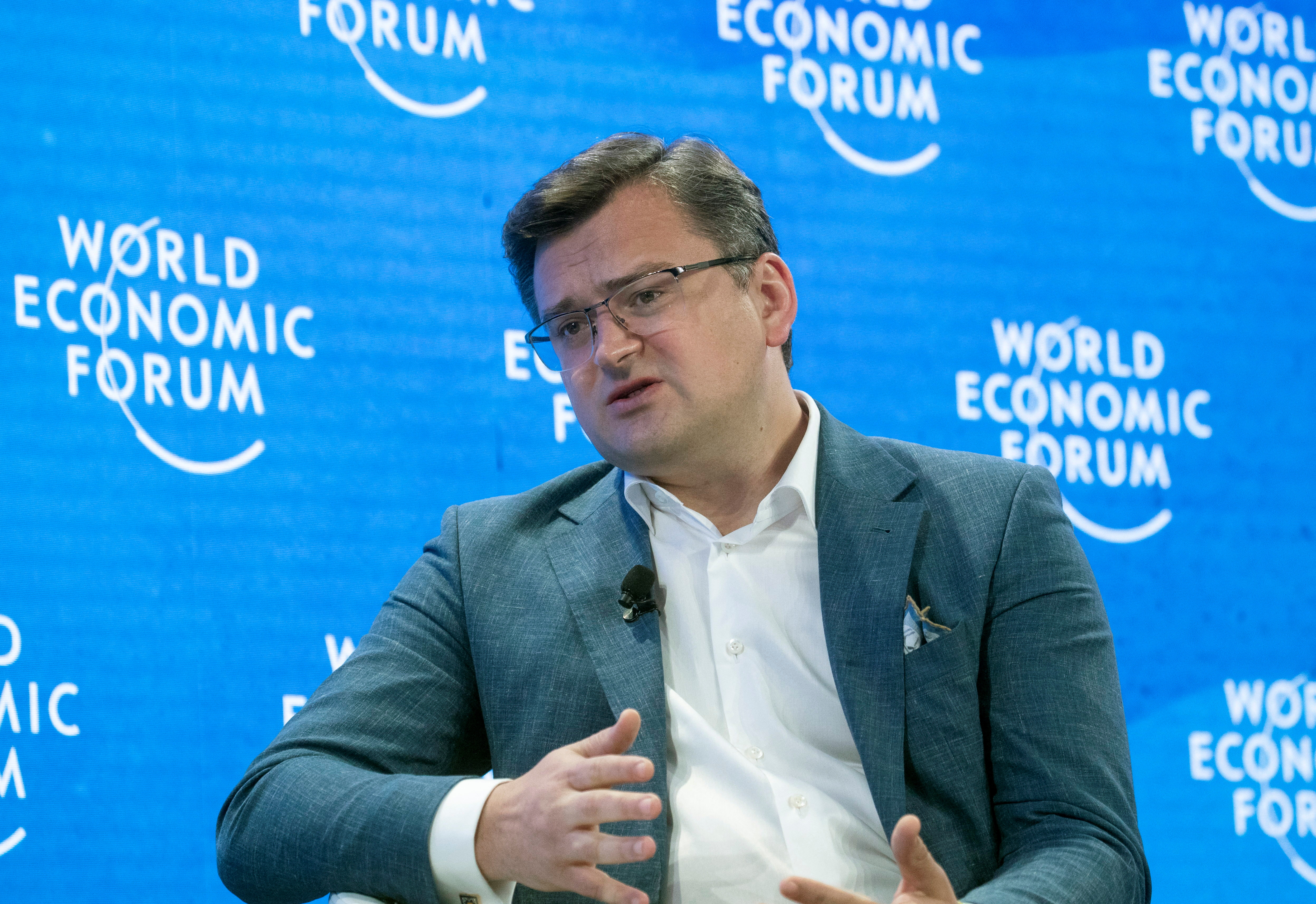 Ukrainian Foreign Minister Kuleba gestures during a discussion WEF 2022 in Davos