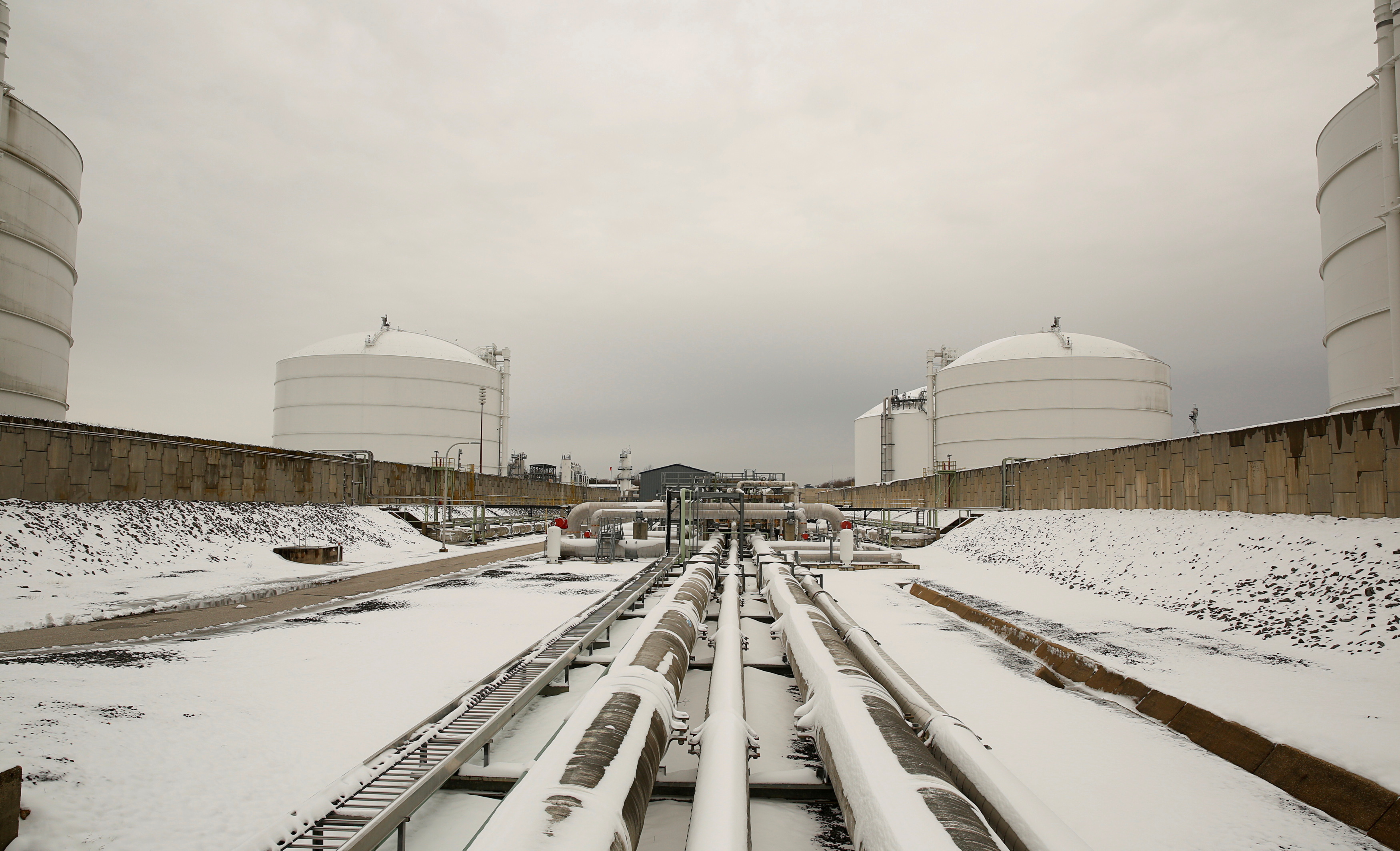 Snow covered transfer lines leading to storage tanks at the Dominion Cove Point Liquefied Natural Gas (LNG) terminal in Lusby, Maryland, March 18, 2014. REUTERS/Gary Cameron