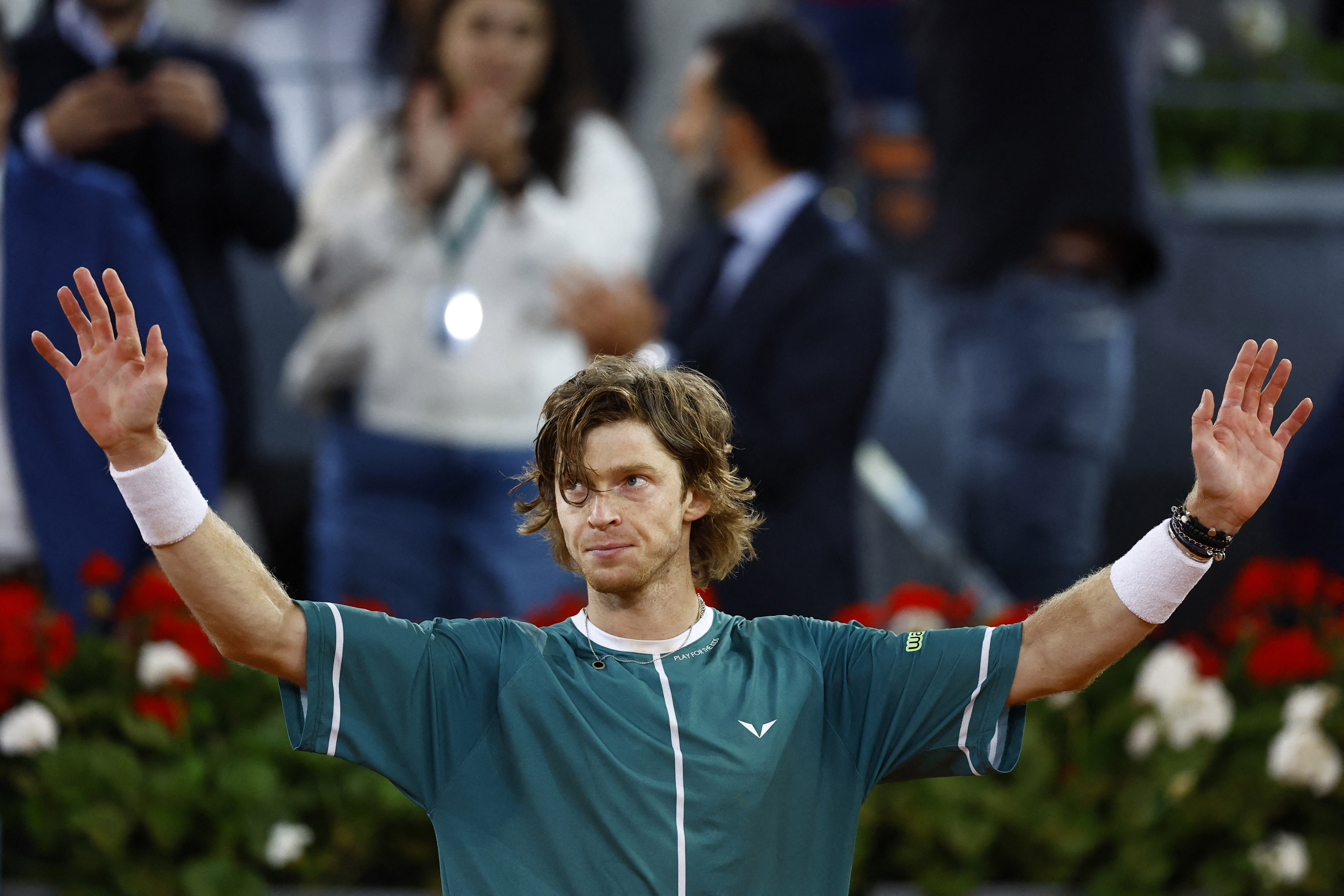 Fiery Rublev keeps a cool head to move on in Madrid | Reuters