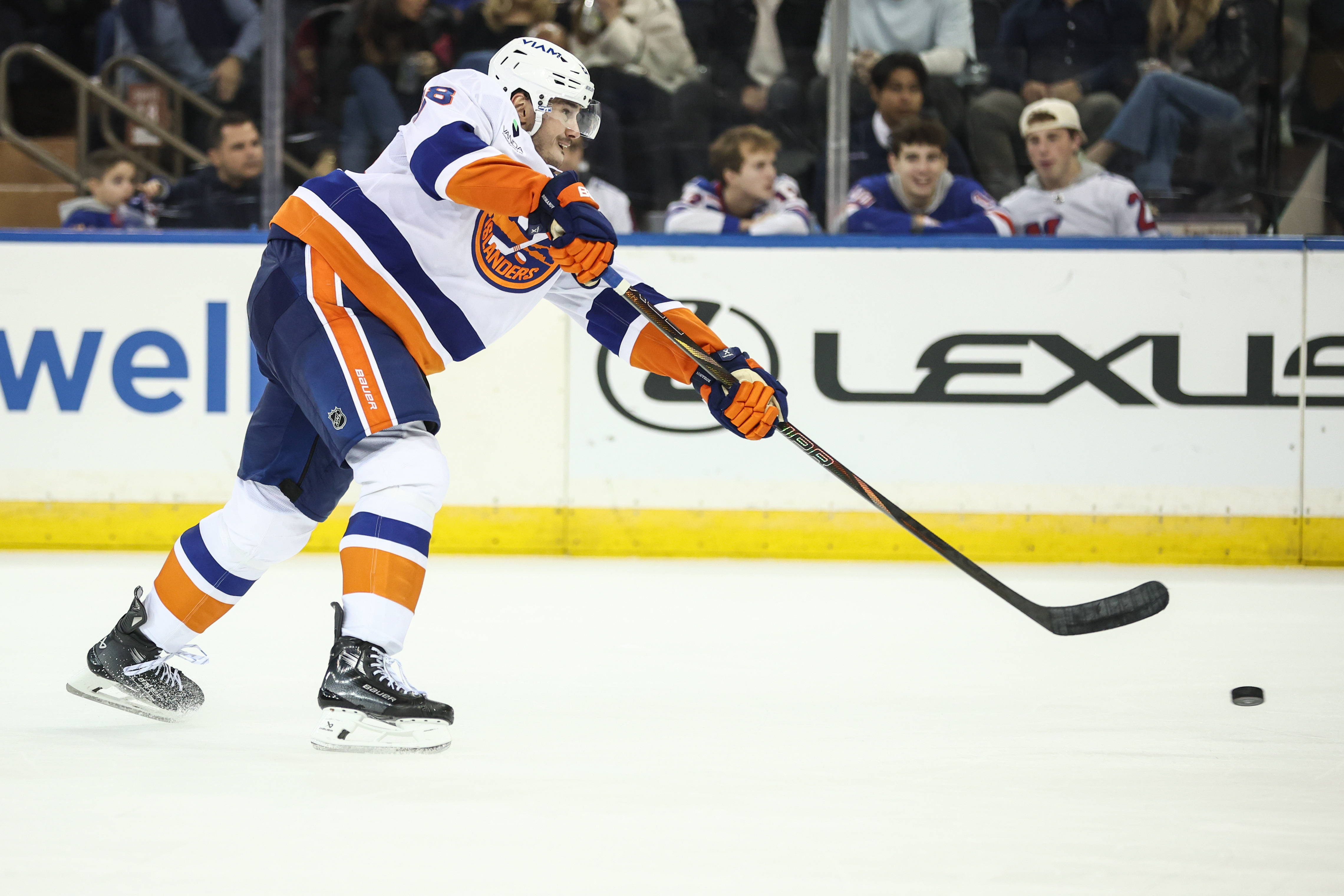 Alexander Romanov in Islanders white road uniform in 2025