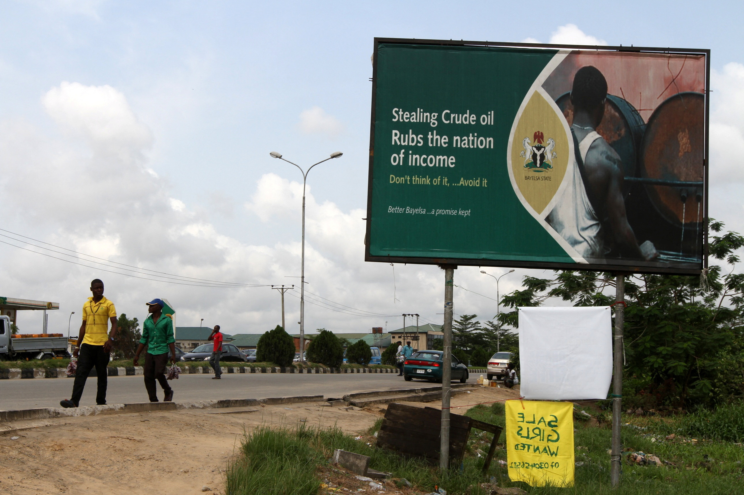 A billboard campaign against crude oil theft is seen alongside a road in Yenagoa, the capital of Nigeria's oil state of Bayelsa