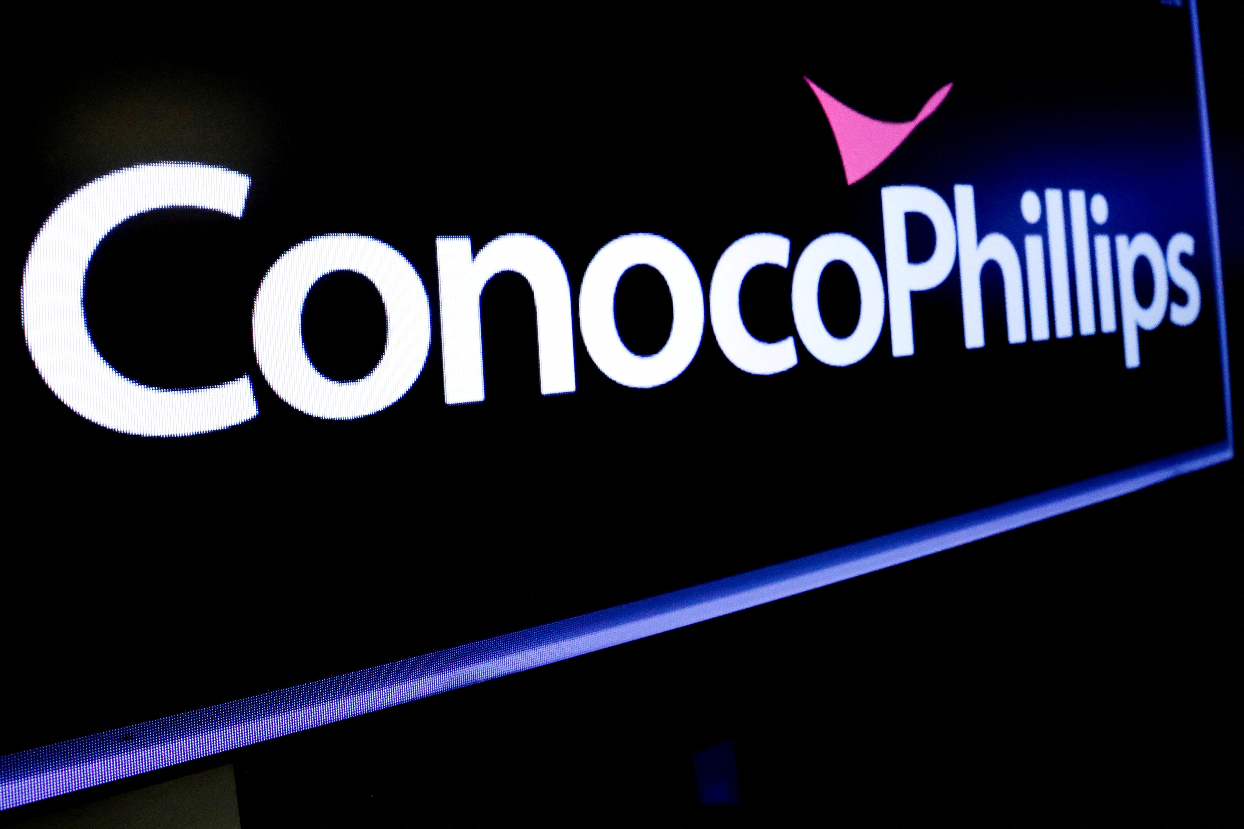 The logo for ConocoPhillips is displayed on a screen on the floor at the NYSE in New York