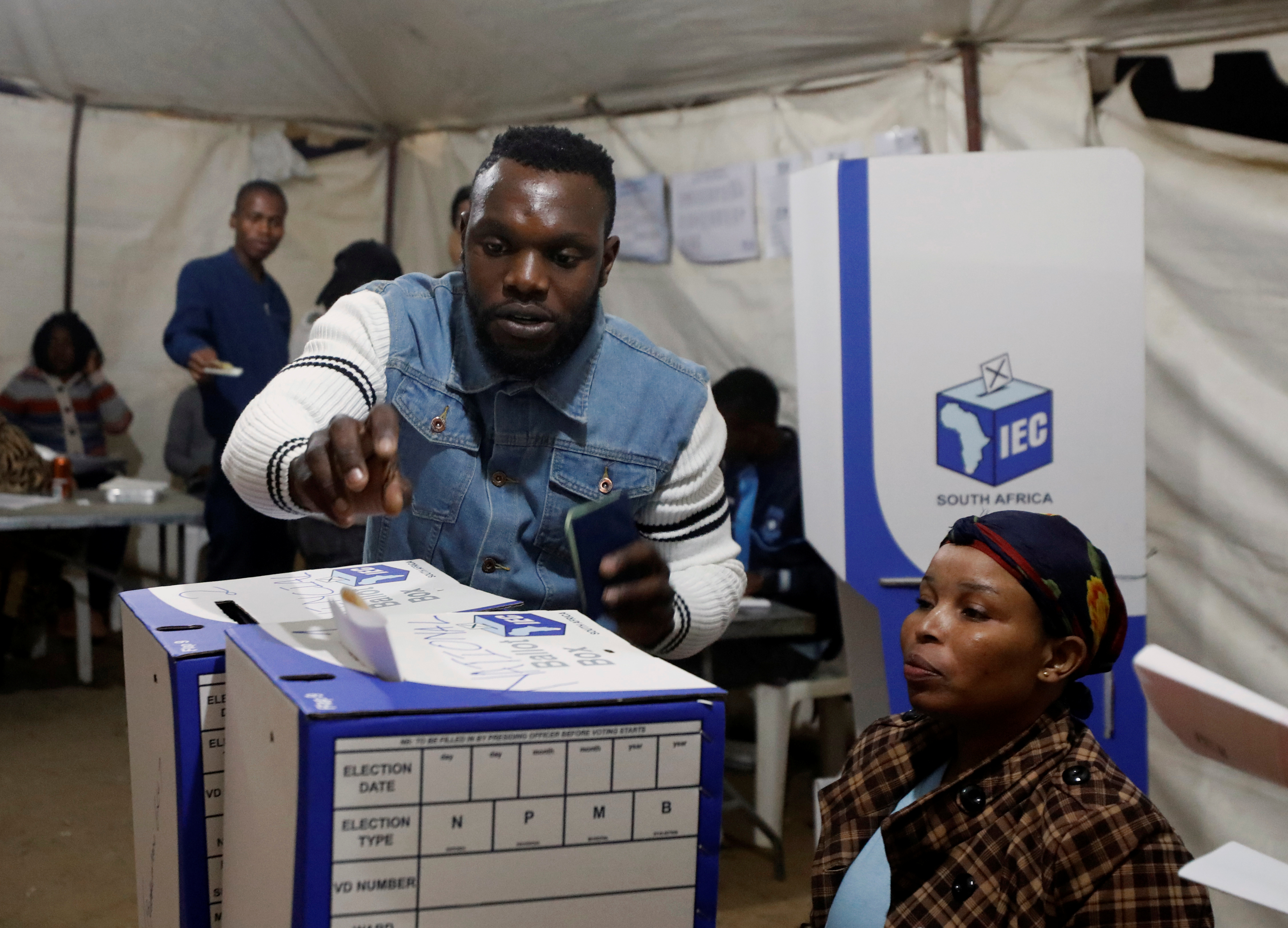 A man casts his ballot just before polls close in South Africa's parliamentary and provincial elections at a voting station in Alexandra township in Johannesburg, South Africa, May 8,2019. REUTERS/Mike Hutchings