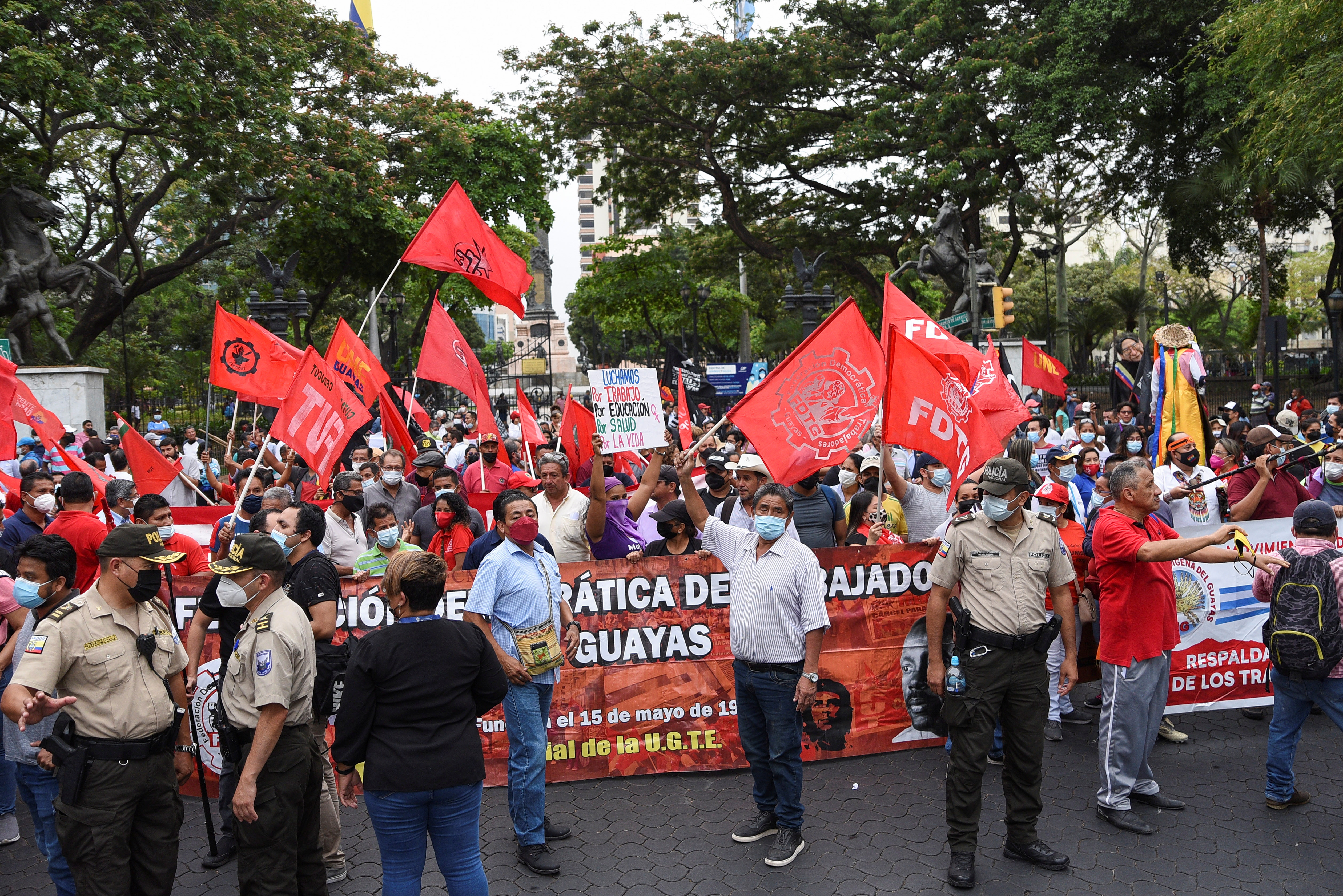 People protest against the economic policies of conservative Ecuadorean President Guillermo Lasso, days after he raised gasoline prices, in Guayaquil, Ecuador October 26, 2021. REUTERS/Vicente Gaibor del Pino