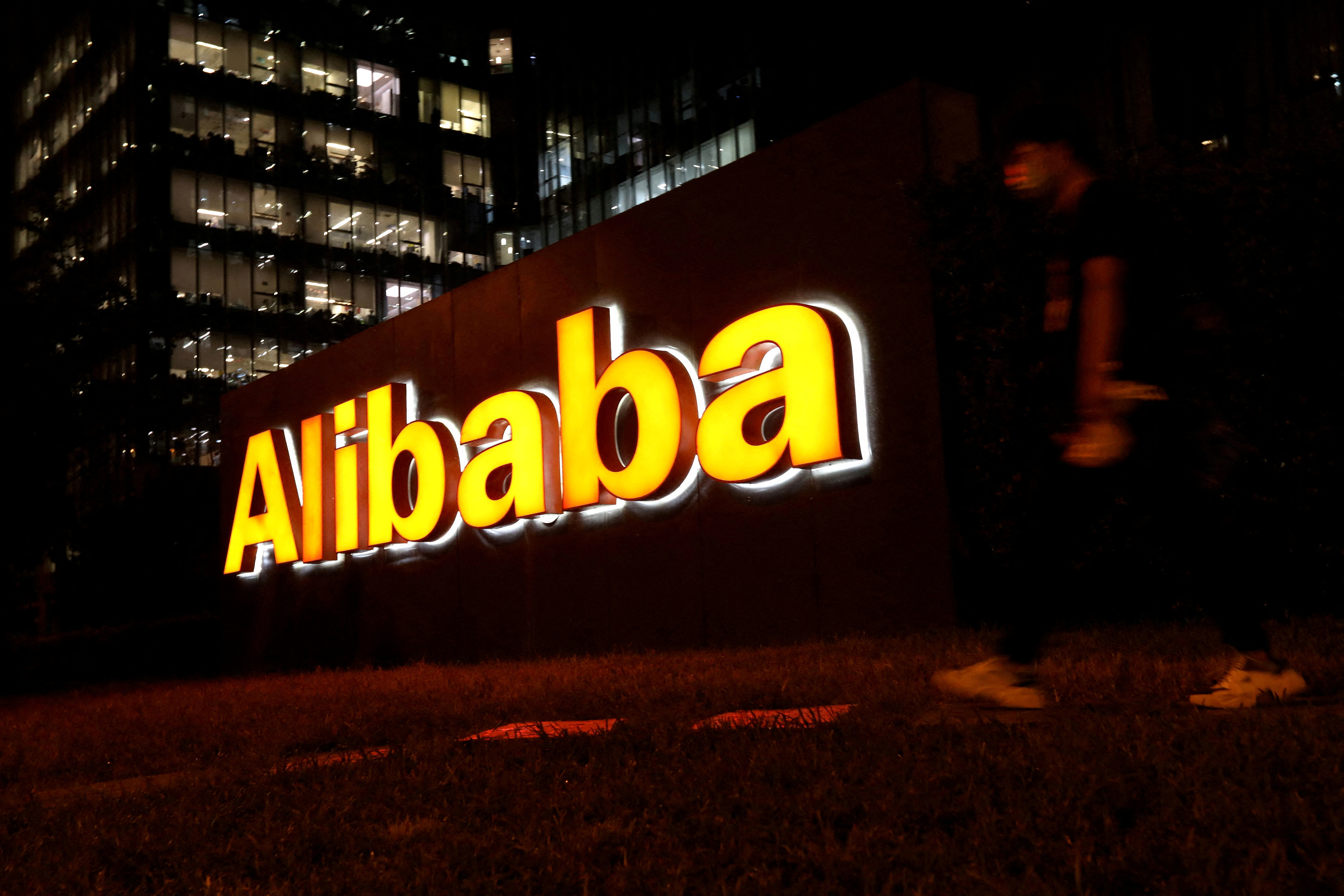 Man walks past the Alibaba Group office building in Beijing, China