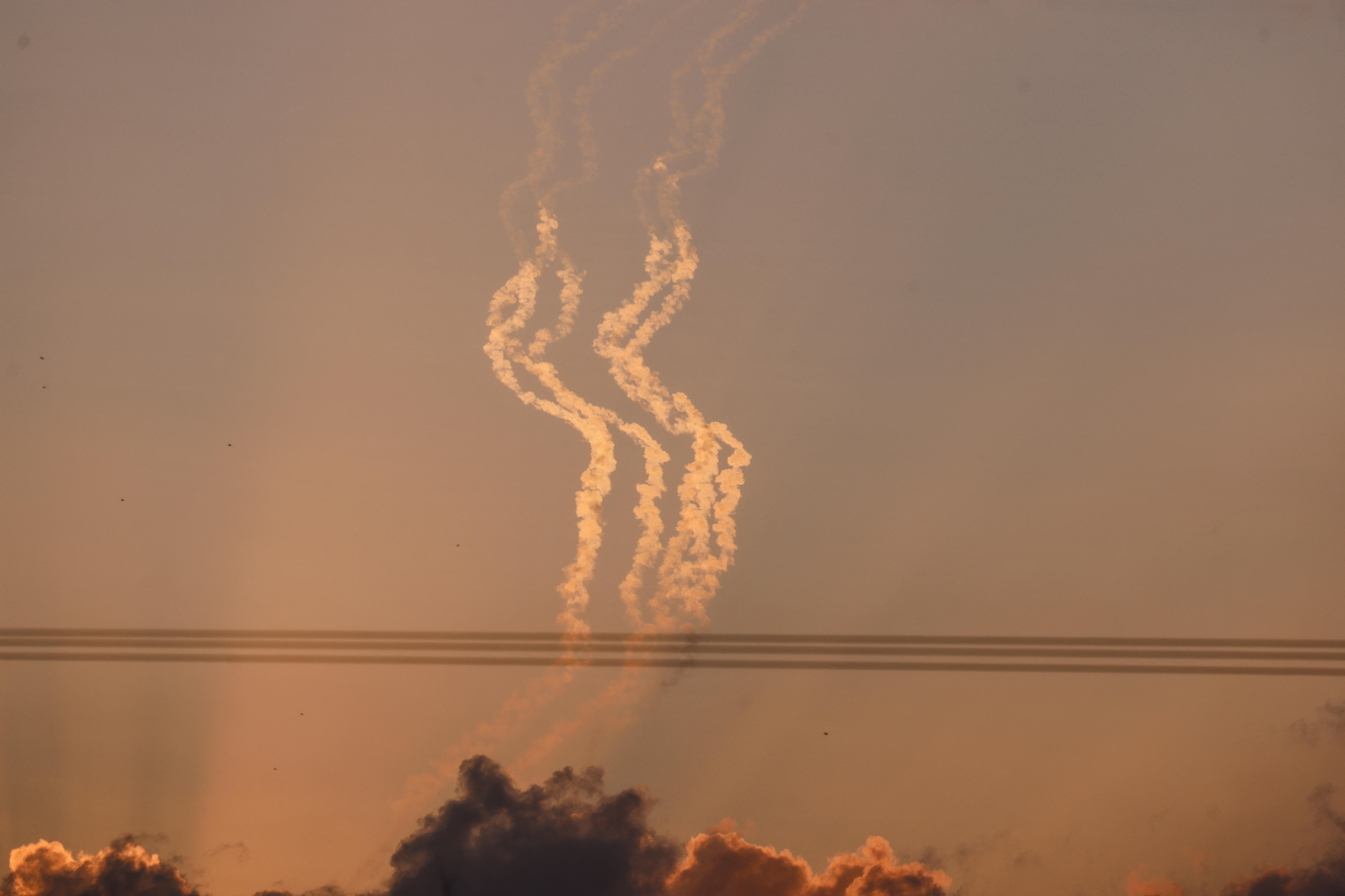 Trails of smoke are seen in the sky, amid the ongoing conflict between Israel and the Palestinian Islamist group Hamas
