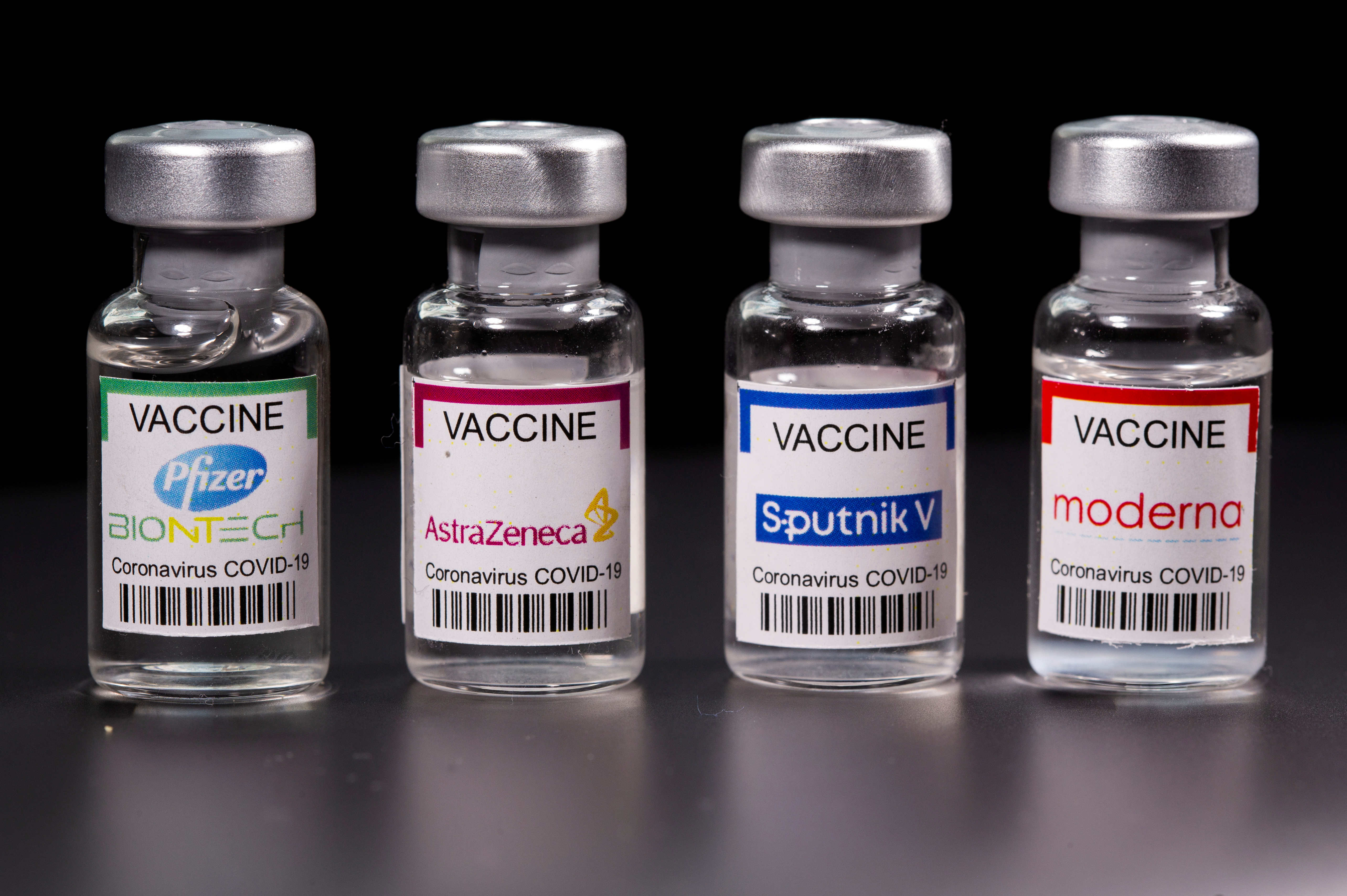 Picture illustration of vials with Pfizer-BioNTech, AstraZeneca, Sputnik V, and Moderna coronavirus disease (COVID-19) vaccine labels