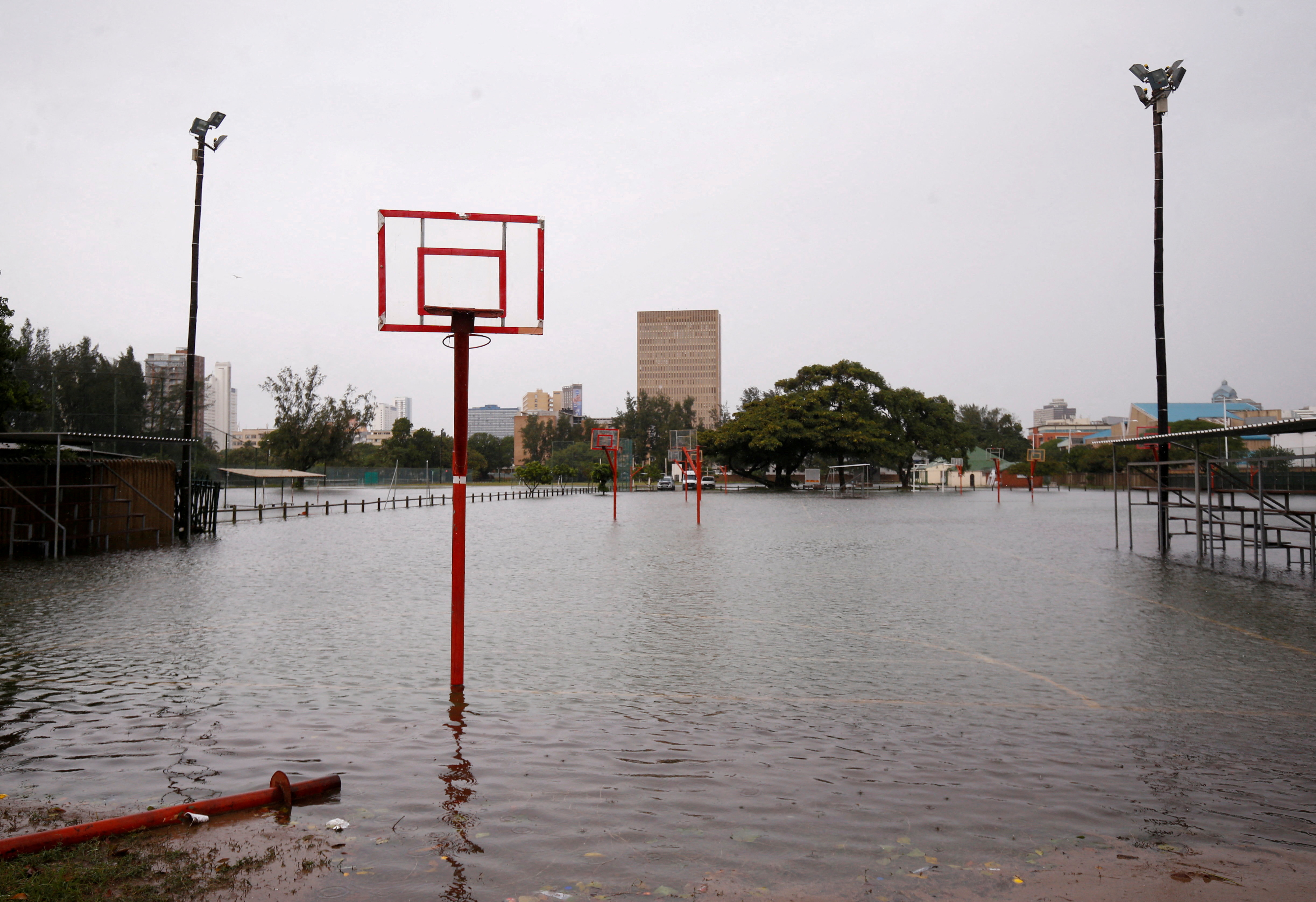 Waterlogged basketball courts are pictured after heavy rains in Durban