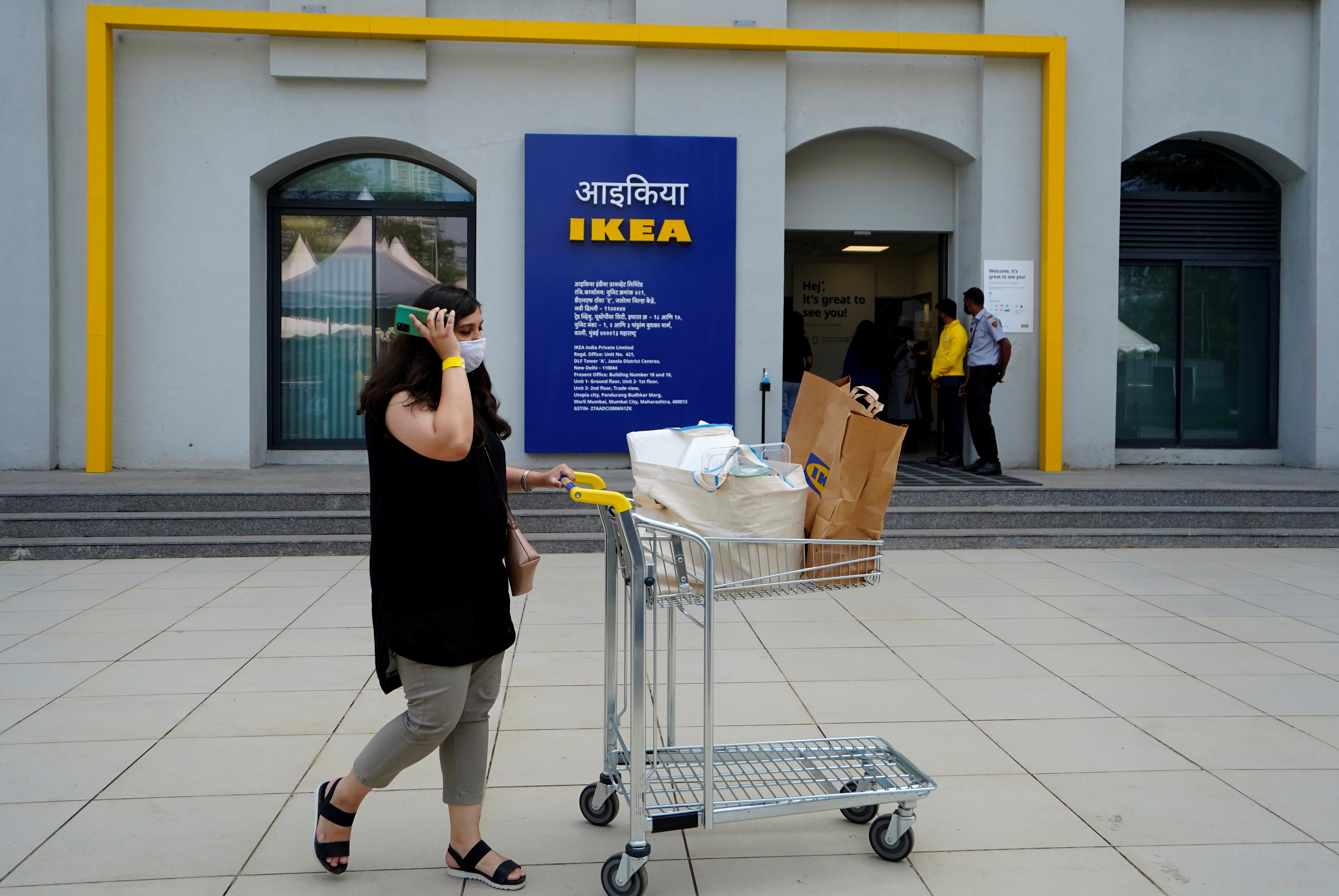 A woman walks after shopping at IKEA's first city store in Mumbai