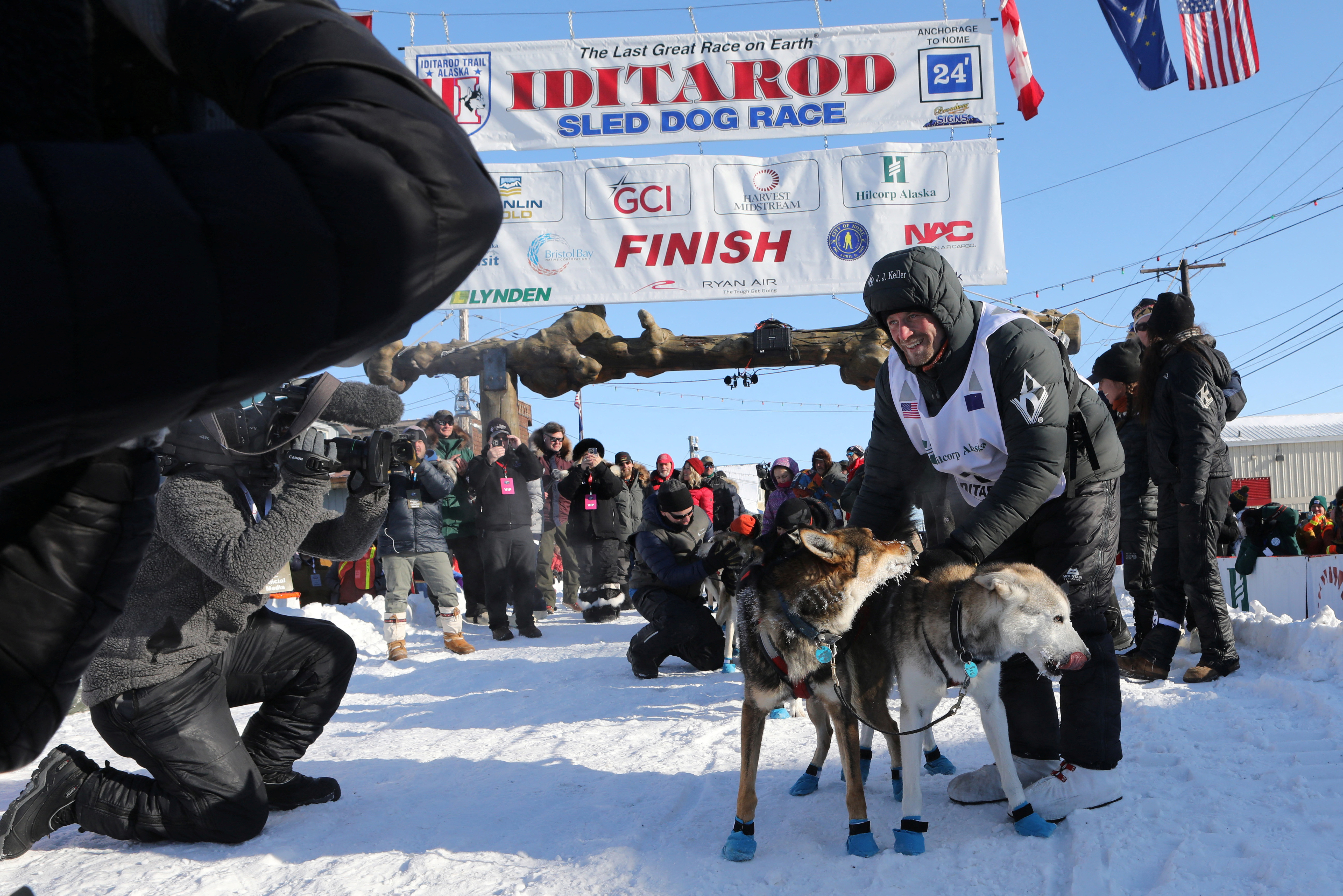 Iditarod champion Dallas Seavey thanks his dog team shortly after winning the 52nd Iditarod Trail Sled Dog Race in Nome