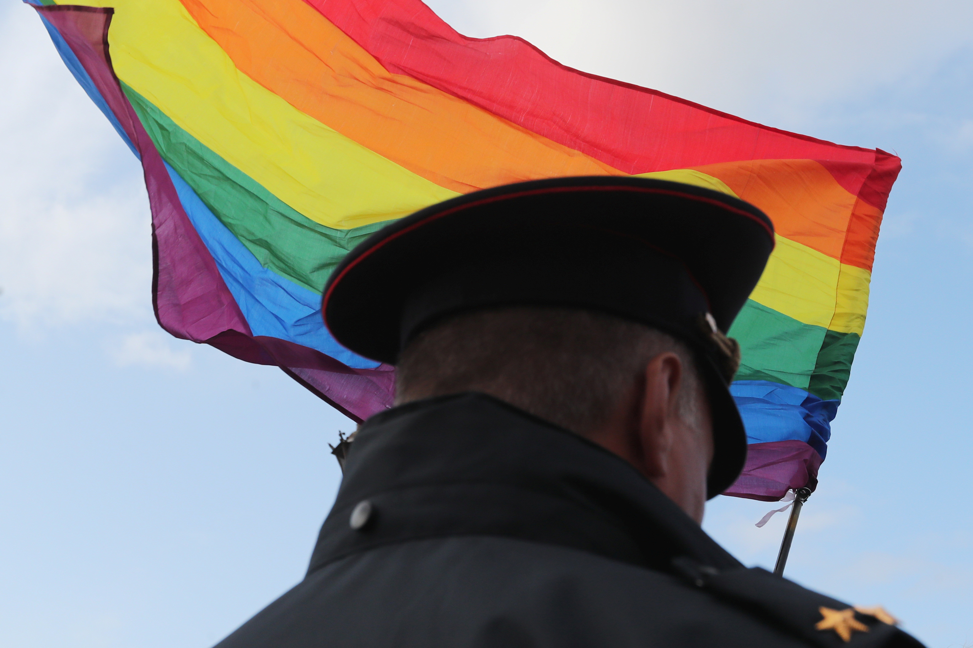 A law enforcement officer stands guard during the LGBT community rally 