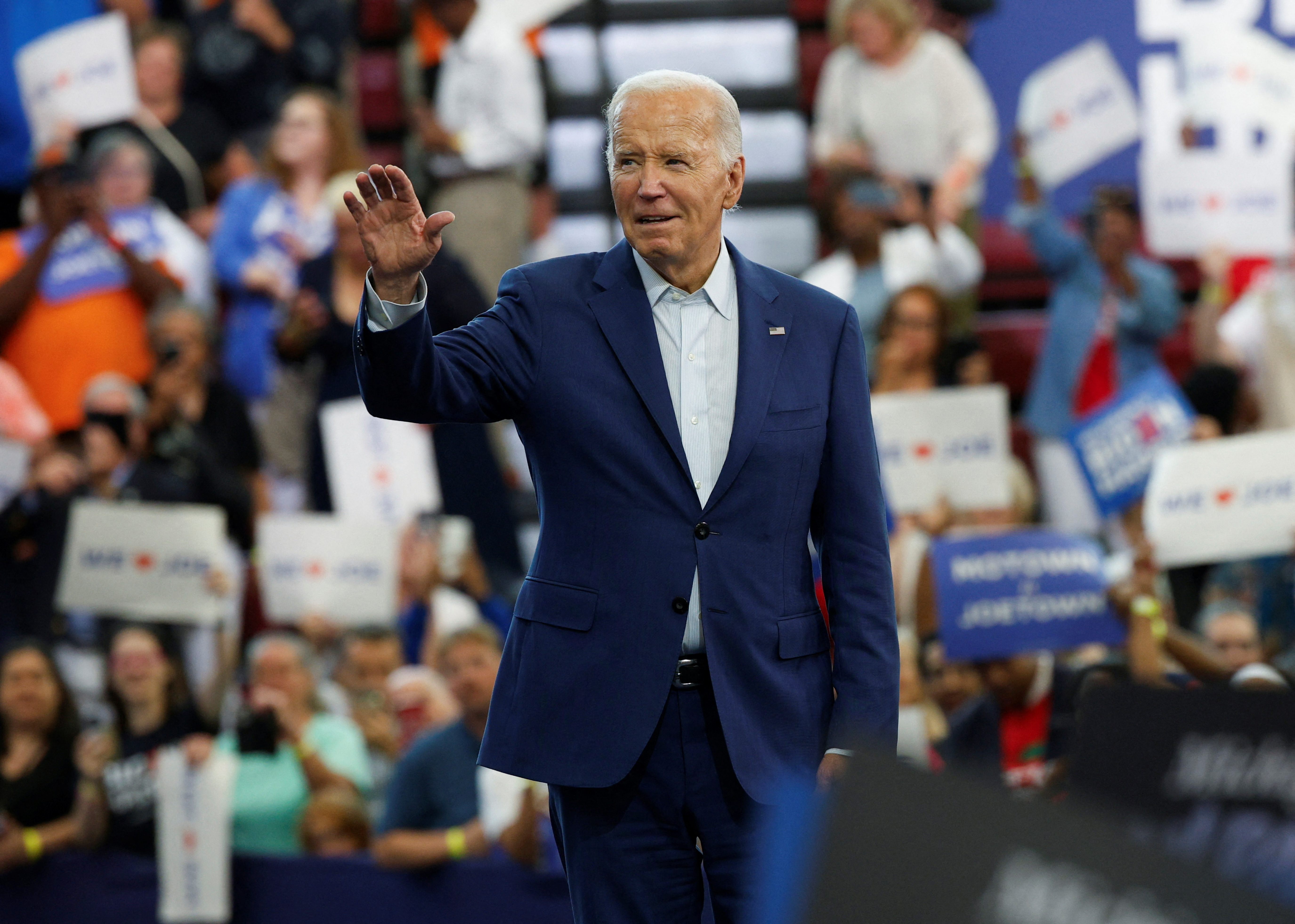 U.S. President Joe Biden waves to his supporters during a campaign stop in Detroit